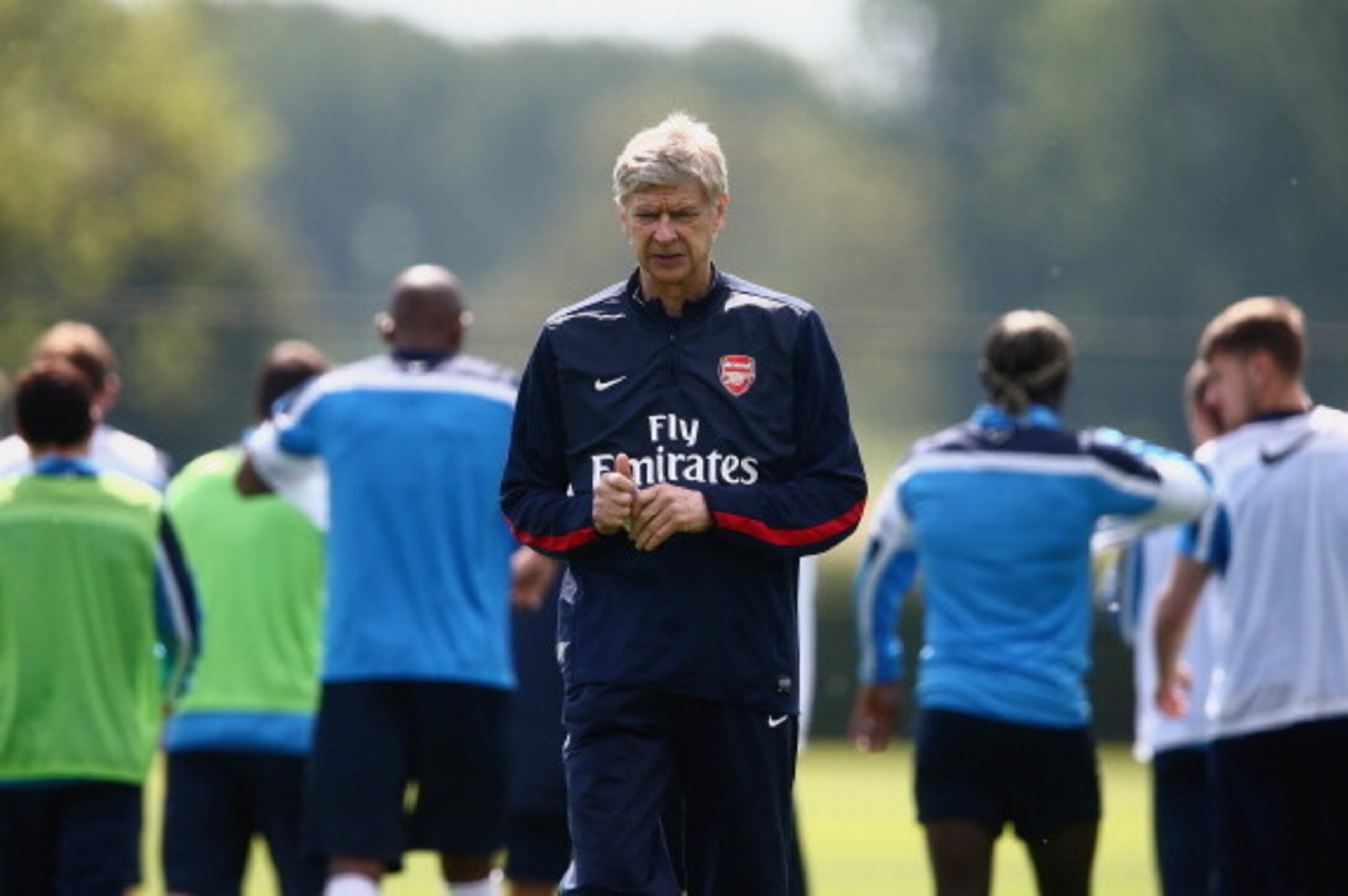 ST ALBANS, ENGLAND - MAY 14: Arsene Wenger of Arsenal looks on during a training session ahead of the FA Cup Final match between Arsenal and Hull City at London Colney on May 14, 2014 in St Albans, England. (Photo by Clive Mason/Getty Images) ST ALBANS, ENGLAND - MAY 14: Arsene Wenger of Arsenal looks on during a training session ahead of the FA Cup Final match between Arsenal and Hull City at London Colney on May 14, 2014 in St Albans, England. (Photo by Clive Mason/Getty Images)