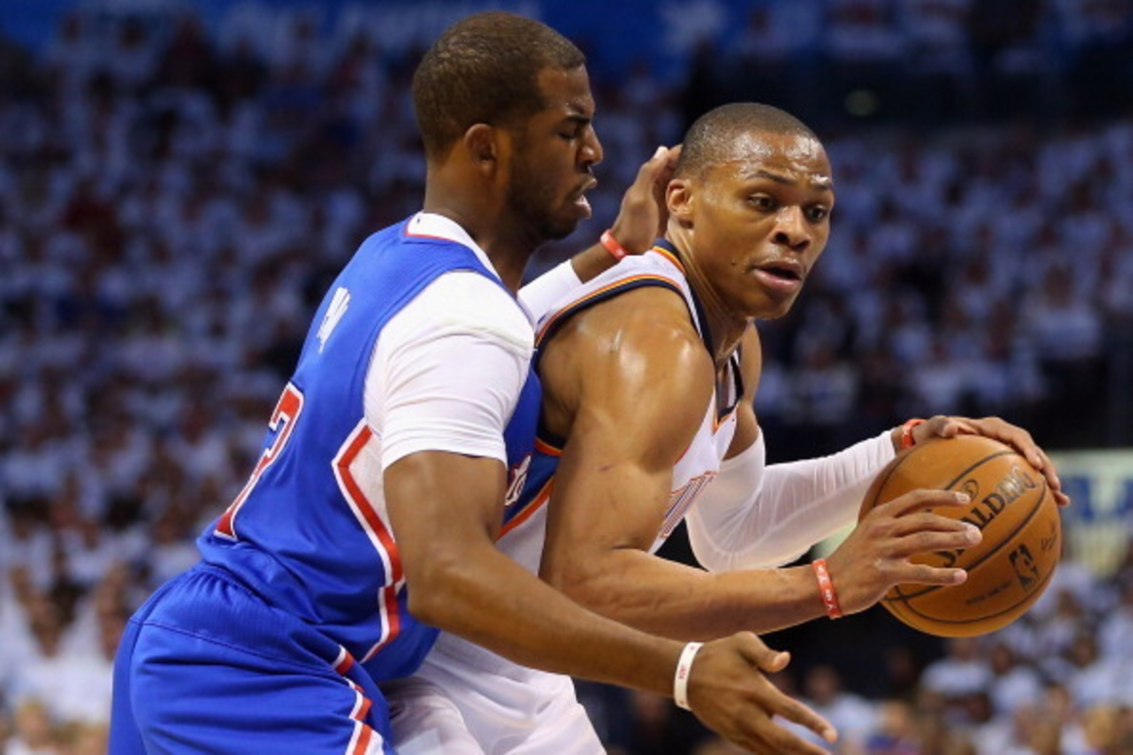 OKLAHOMA CITY, OK - MAY 13:  (L-R) Chris Paul #3 of the Los Angeles Clippers defends Russell Westbrook #0 of the Oklahoma City Thunder in Game Five of the Western Conference Semifinals during the 2014 NBA Playoffs at Chesapeake Energy Arena on May 13, 201