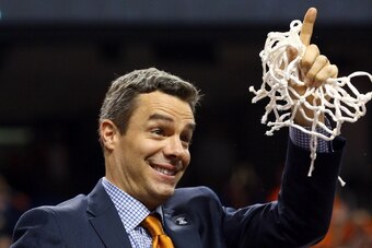 GREENSBORO, NC - MARCH 16:  Virginia Cavaliers head coach Tony Bennett smiles after he cut down the net after they beat the Duke Blue Devils in the finals of the 2014 Men's ACC Basketball Tournament at Greensboro Coliseum on March 16, 2014 in Greensboro, 