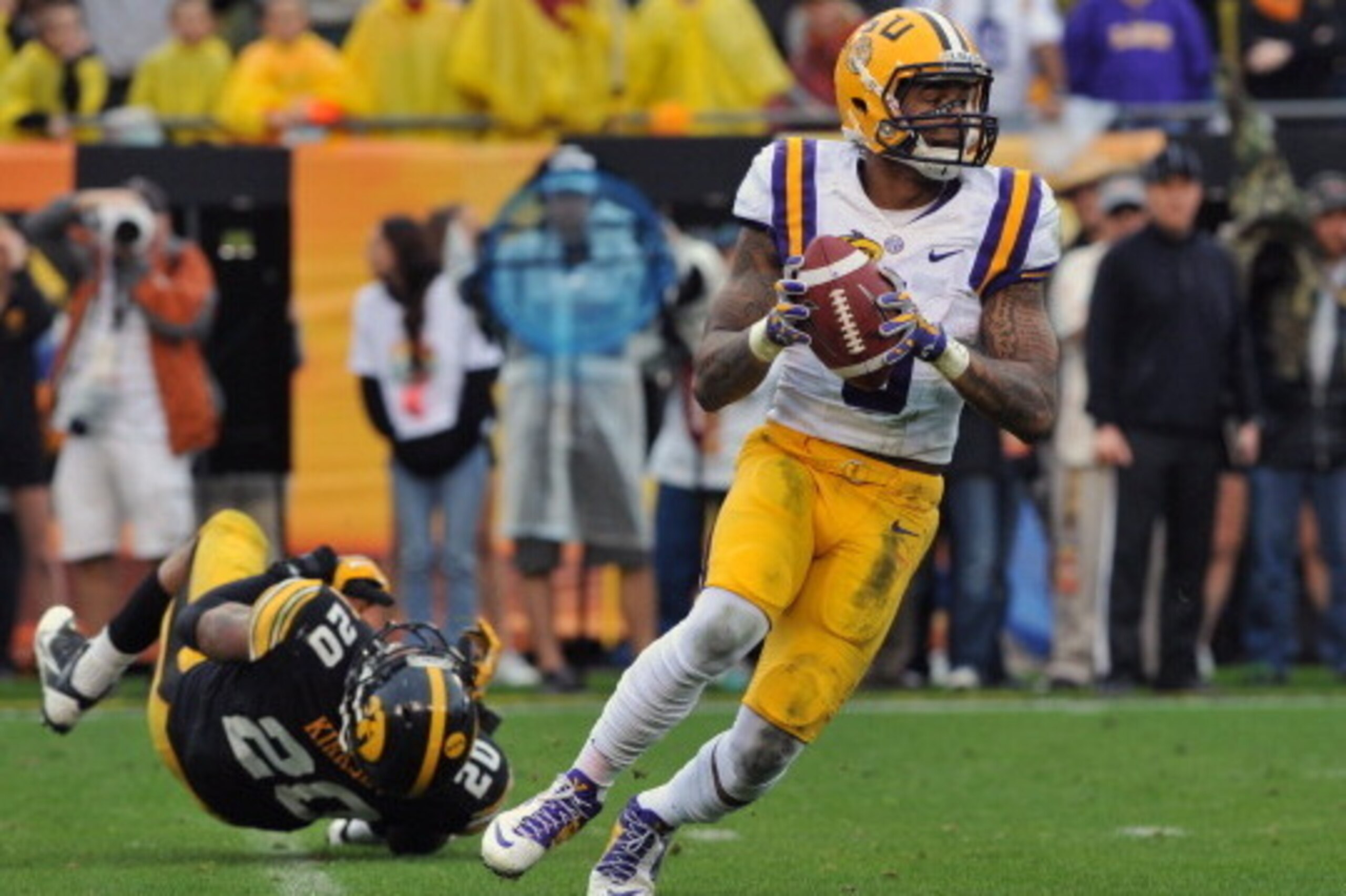TAMPA, FL -  JANUARY 1:  Quarterback Anthony Jennings #10 of the LSU Tigers looks to pass against the Iowa Hawkeyes January 1, 2014  in the Outback Bowl at Raymond James Stadium in Tampa, Florida. LSU won 21-14.  (Photo by Al Messerschmidt/Getty Images)