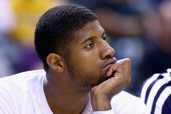 INDIANAPOLIS, IN - MAY 13:  Paul George #24 of the Indiana Pacers watches from the bench in the fourth quater of the 102-79 loss to the Washington Wizards in Game 5 of the Eastern Conference Semifinals during the 2014 NBA Playoffs at Bankers Life Fieldhou
