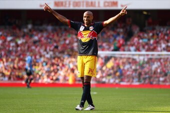 LONDON, ENGLAND - JULY 31:  Thierry Henry of New York Red Bulls celebrates after Kyle Bartley of Arsenal scores an own goal during the Emirates Cup match between Arsenal and New York Red Bulls at the Emirates Stadium on July 31, 2011 in London, England.  