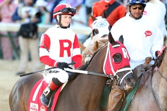 LOUISVILLE, KY - MAY 03:  Vicar's In Trouble #1, ridden by Rosie Napravnik, takes part in the post parade prior the 140th running of the Kentucky Derby at Churchill Downs on May 3, 2014 in Louisville, Kentucky.  (Photo by Matthew Stockman/Getty Images)