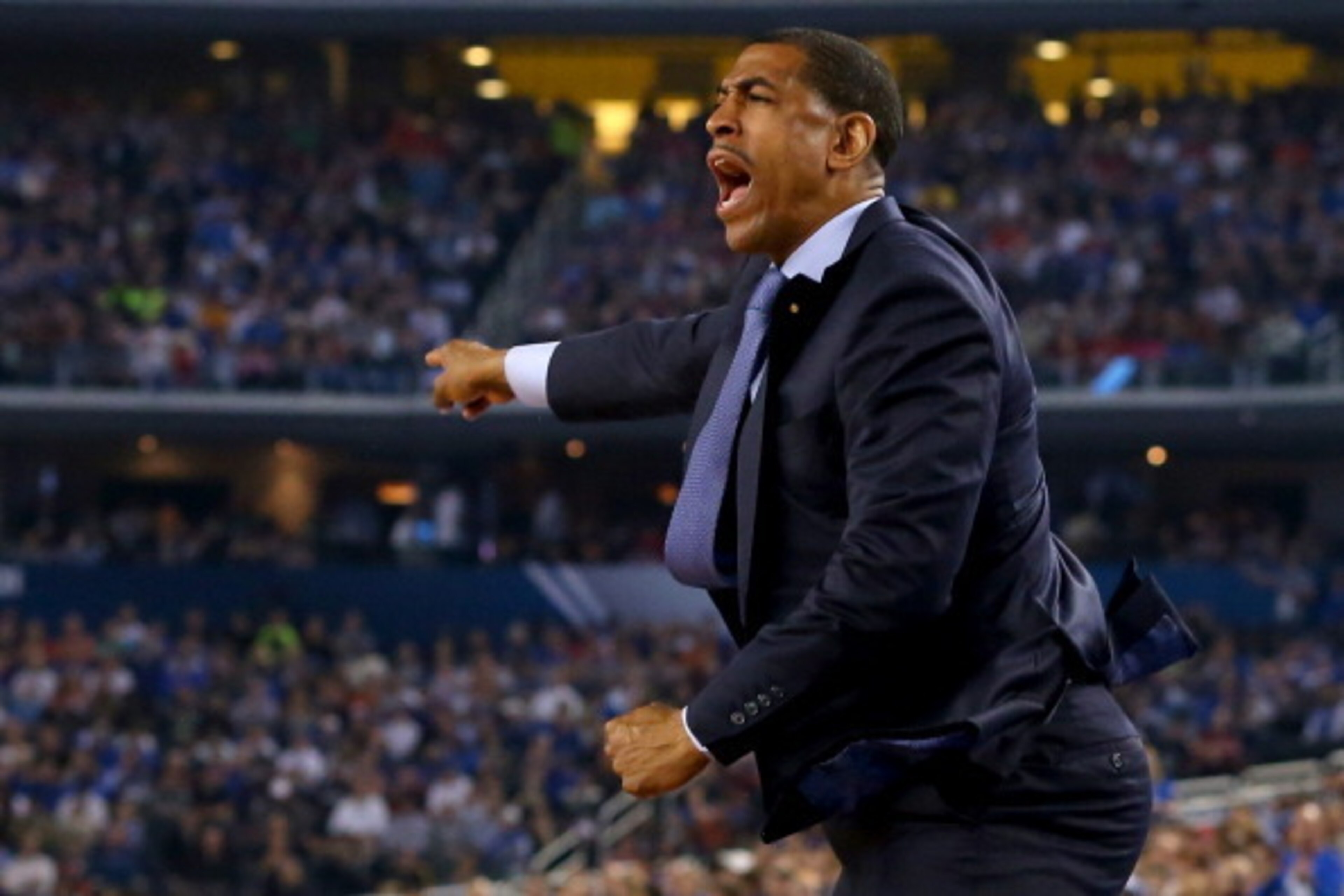 ARLINGTON, TX - APRIL 07: Head coach Kevin Ollie of the Connecticut Huskies calls to his players during the NCAA Men's Final Four Championship against the Kentucky Wildcats at AT&T Stadium on April 7, 2014 in Arlington, Texas.  (Photo by Ronald Martinez/G
