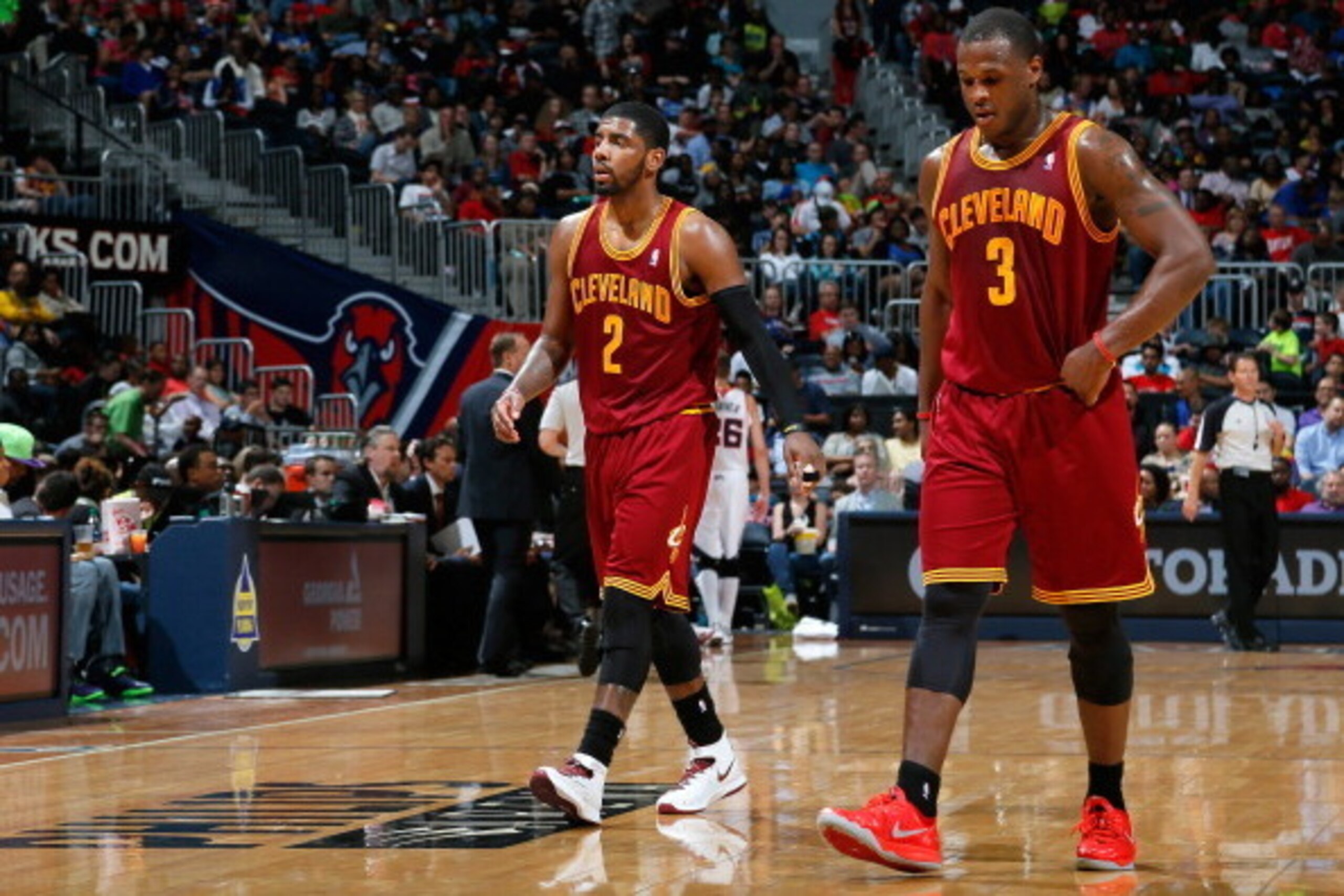ATLANTA, GA - APRIL 04:  Kyrie Irving #2 and Dion Waiters #3 of the Cleveland Cavaliers walk off the court between free throws in their 117-98 loss to the Atlanta Hawks at Philips Arena on April 4, 2014 in Atlanta, Georgia.  NOTE TO USER: User expressly a