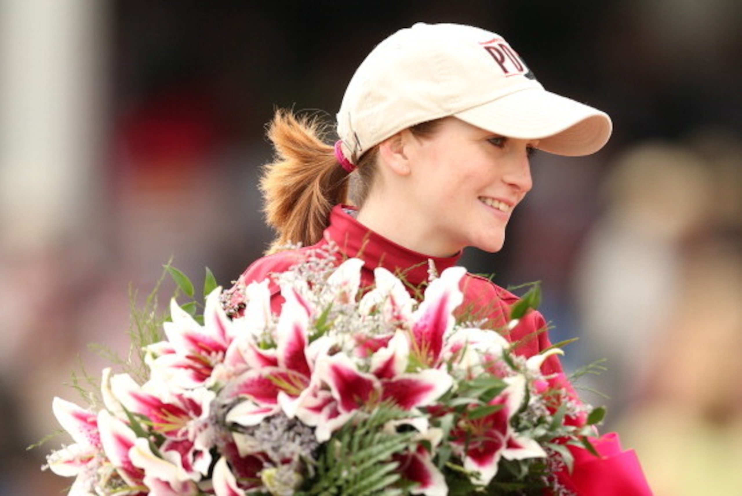 LOUISVILLE, KY - MAY 02:  Jockey Rosie Napravnik, celebrates atop of Untapable #13 after crossing the finish line to win the 140th running of the Kentucky Oaks at Churchill Downs on May 2, 2014 in Louisville, Kentucky.  (Photo by Matthew Stockman/Getty Im