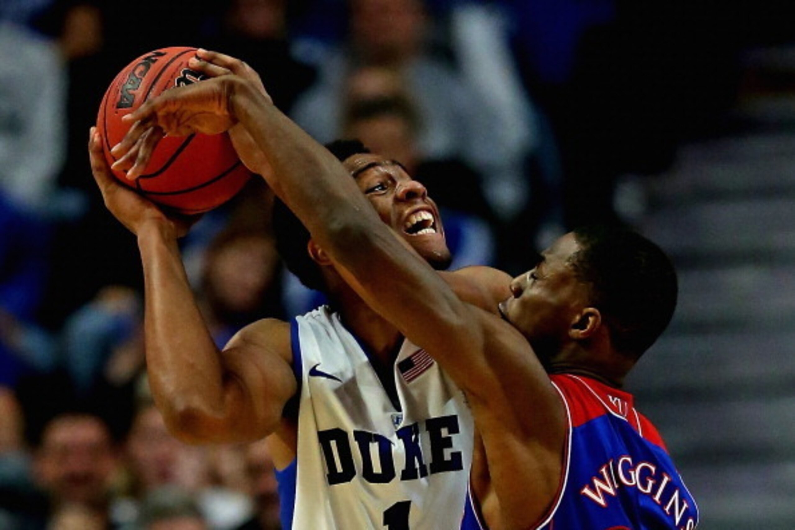 CHICAGO, IL - NOVEMBER 12: Jabari Parker #1 of the Duke Blue Devils tries to shoot against Andrew Wiggins #22 of the Kansas Jayhawks during the State Farm Champions Classic at the United Center on November 12, 2013 in Chicago, Illinois. Kansas defeated Du CHICAGO, IL - NOVEMBER 12: Jabari Parker #1 of the Duke Blue Devils tries to shoot against Andrew Wiggins #22 of the Kansas Jayhawks during the State Farm Champions Classic at the United Center on November 12, 2013 in Chicago, Illinois. Kansas defeated Du