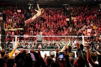 Daniel Bryan dives onto Kane at Extreme Rules from a forklift.