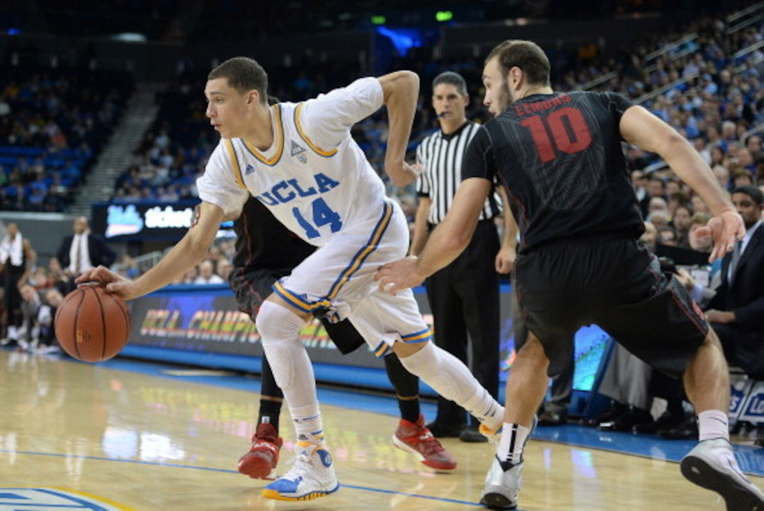 LOS ANGELES, CA - JANUARY 23:  Zach LaVine #14 of the UCLA Bruins dribbles past Robbie Lemons #10 of the Stanford Cardinal during a 91-74 UCLA win at Pauley Pavilion on January 23, 2014 in Los Angeles, California.  (Photo by Harry How/Getty Images)