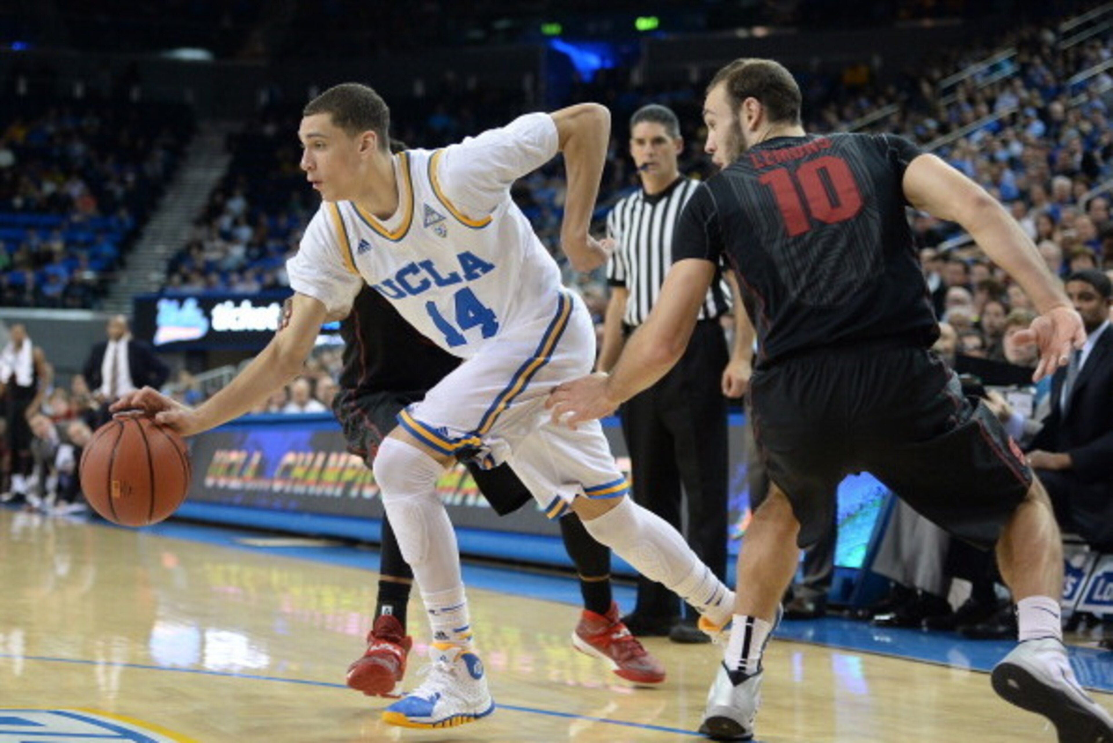 LOS ANGELES, CA - JANUARY 23:  Zach LaVine #14 of the UCLA Bruins dribbles past Robbie Lemons #10 of the Stanford Cardinal during a 91-74 UCLA win at Pauley Pavilion on January 23, 2014 in Los Angeles, California.  (Photo by Harry How/Getty Images)
