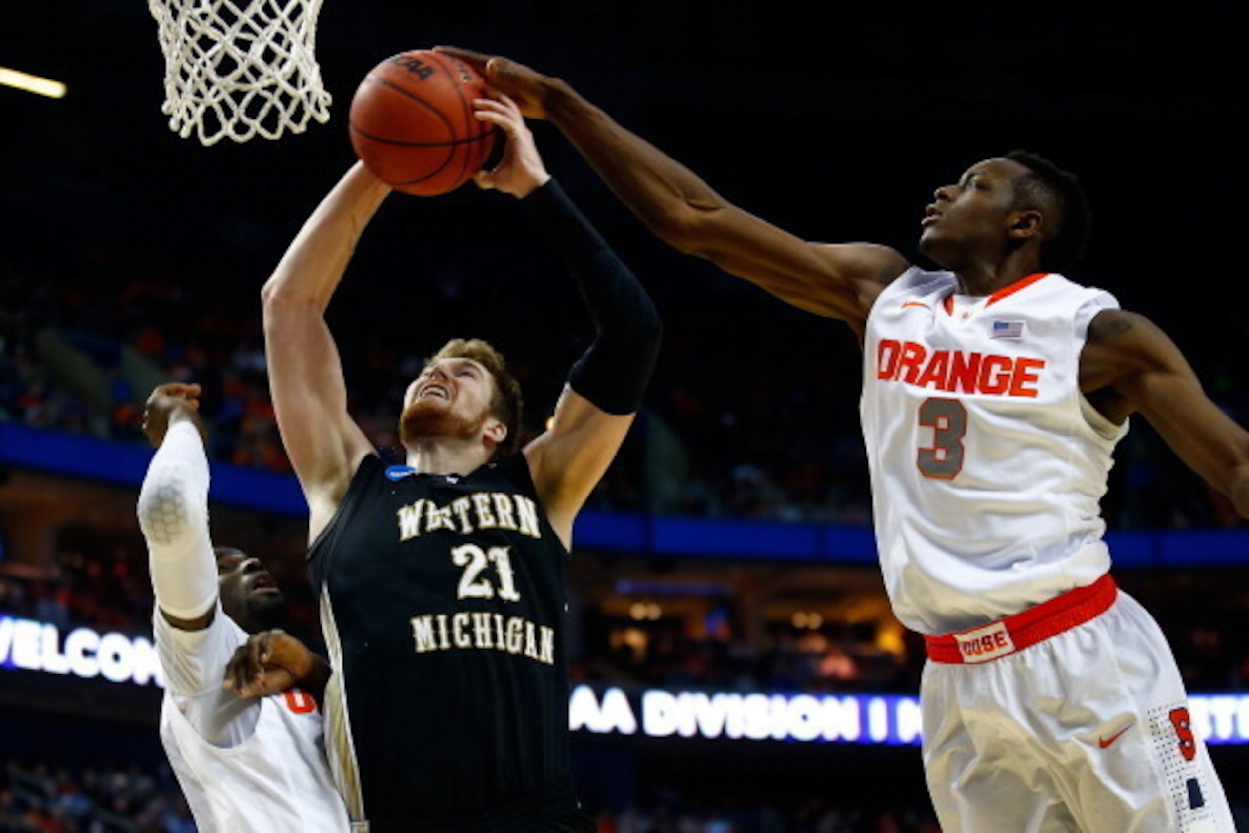 BUFFALO, NY - MARCH 20:  Jerami Grant #3 of the Syracuse Orange blocks a shot by Shayne Whittington #21 of the Western Michigan Broncos during the second round of the 2014 NCAA Men's Basketball Tournament at the First Niagara Center on March 20, 2014 in B