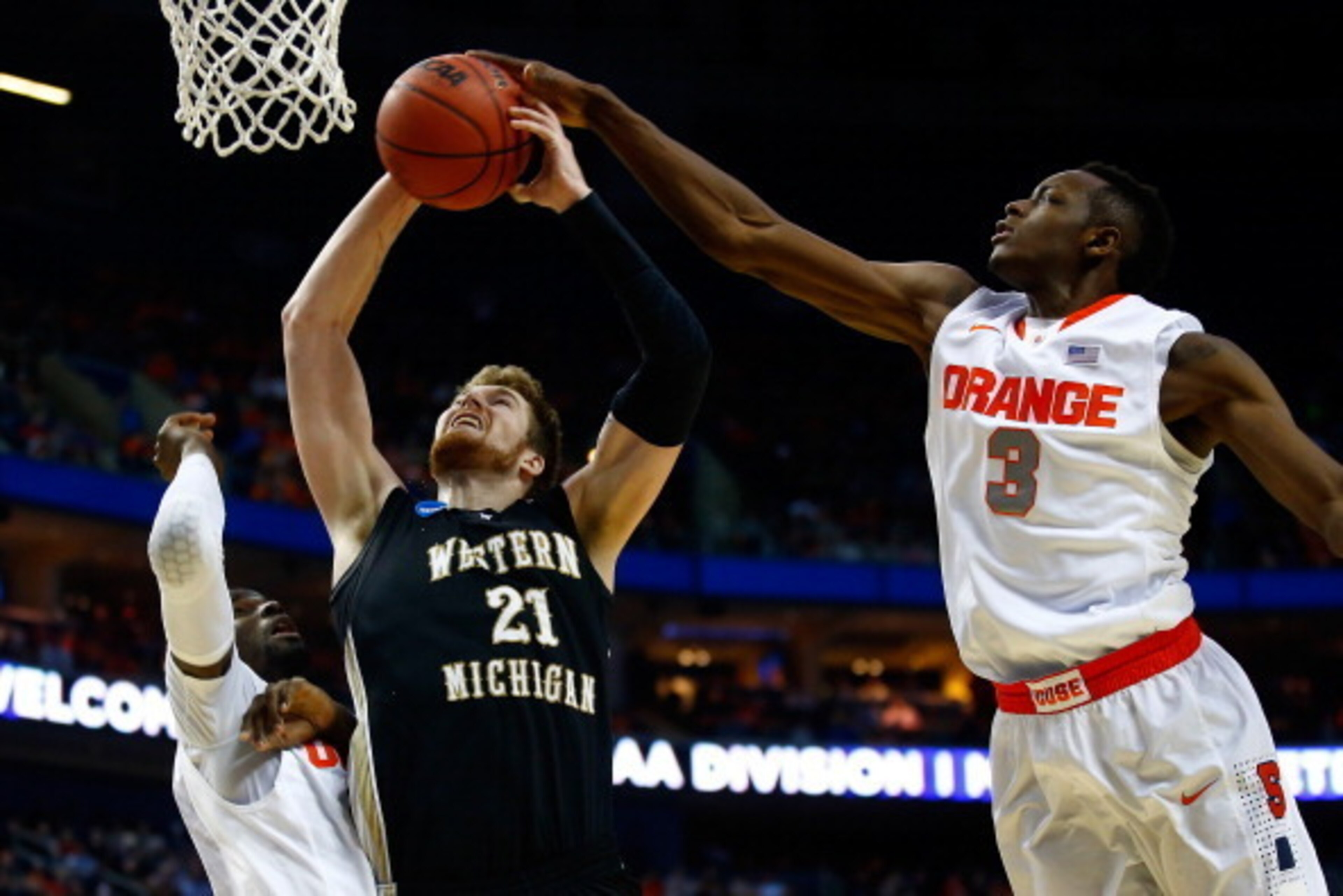 BUFFALO, NY - MARCH 20:  Jerami Grant #3 of the Syracuse Orange blocks a shot by Shayne Whittington #21 of the Western Michigan Broncos during the second round of the 2014 NCAA Men's Basketball Tournament at the First Niagara Center on March 20, 2014 in B