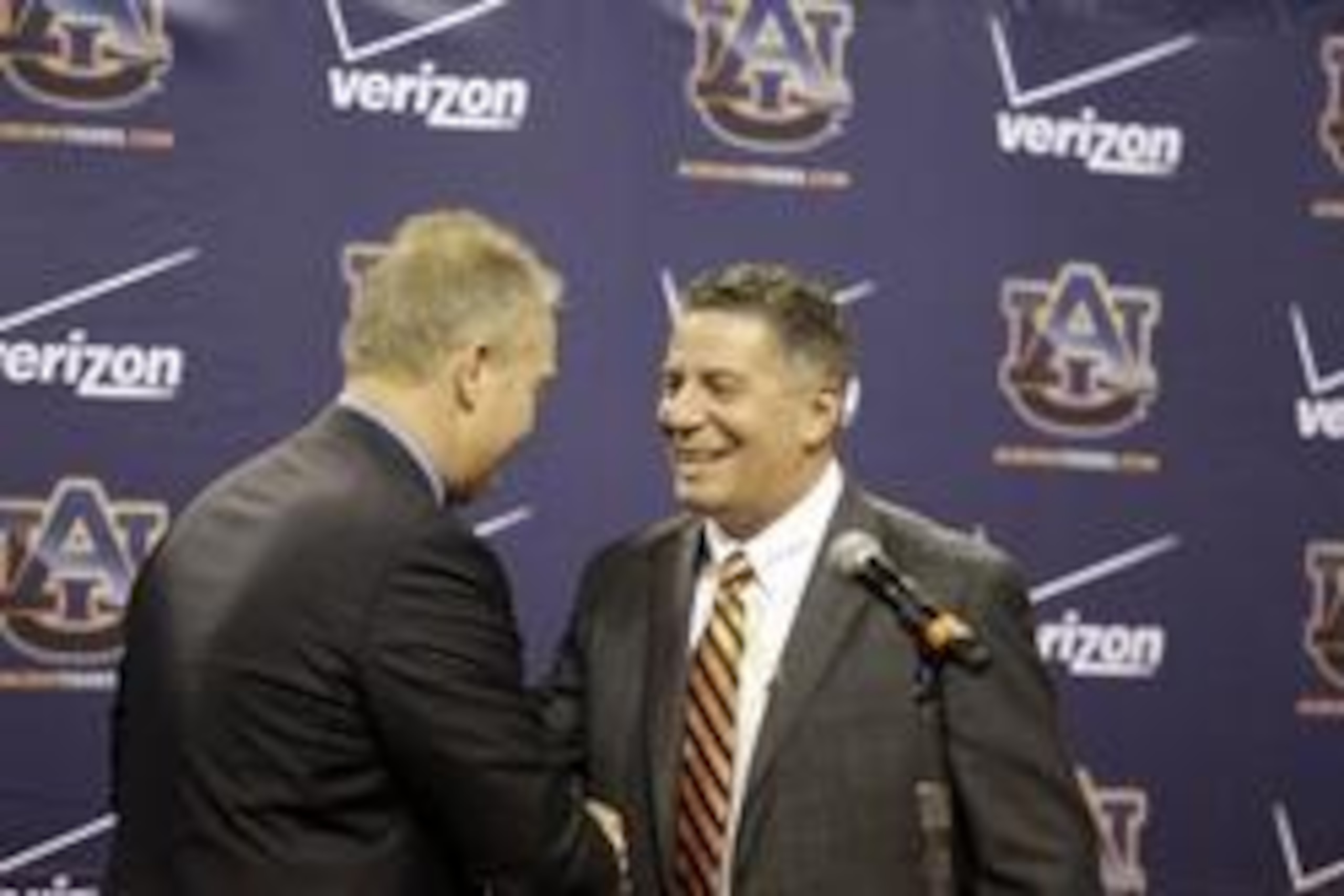 Mar 18, 2014; Auburn, AL, USA; Auburn Tigers head basketball coach Bruce Pearl is welcomed by athletics director Jay Jacobs during his introductory press conference in the Auburn Arena on Tuesday.   Mandatory Credit: John Reed-USA TODAY Sports