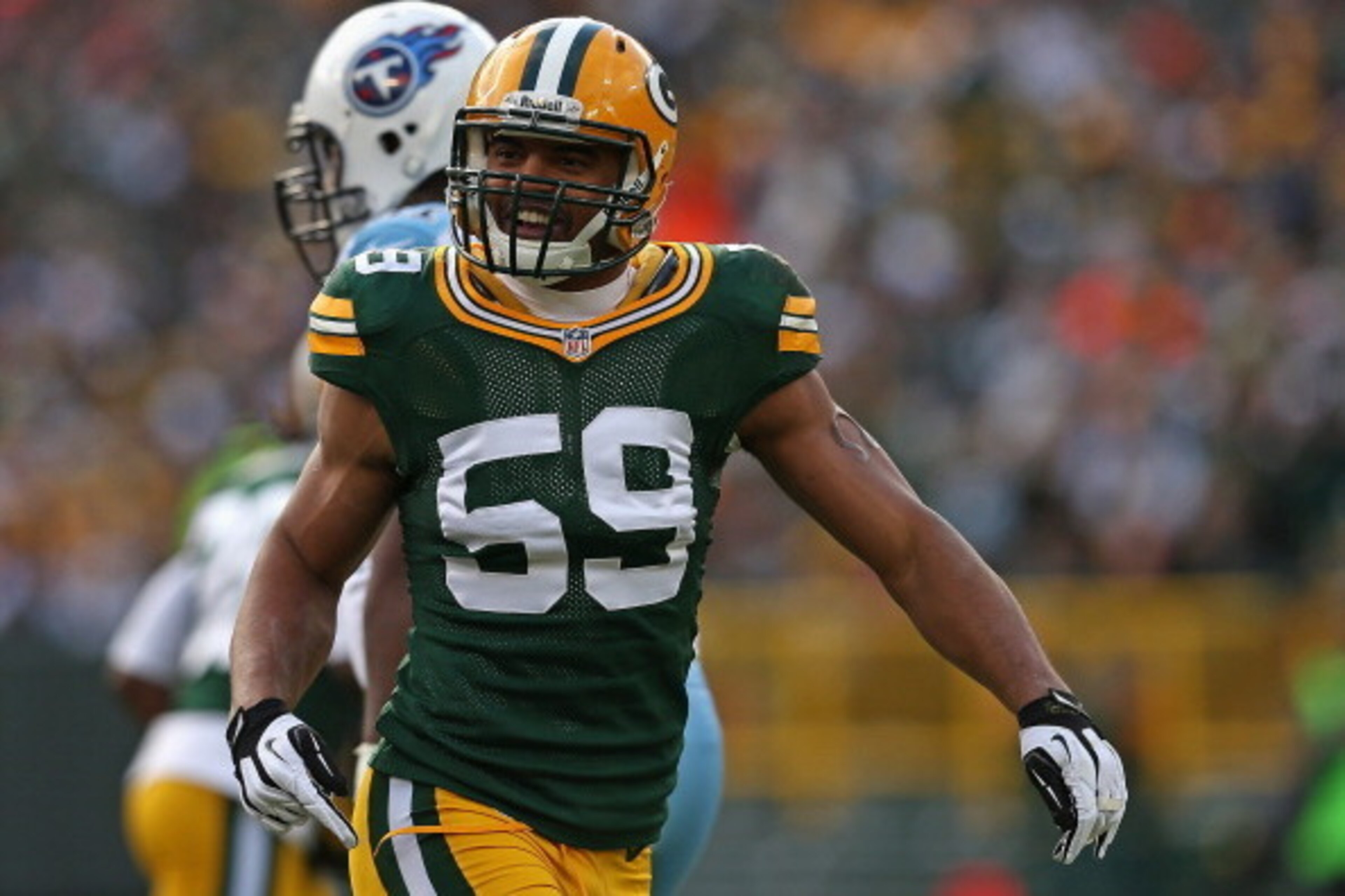 GREEN BAY, WI - DECEMBER 23:  Brad Jones #59 of the Green Bay Packers celebrates a play against the Tennessee Titans at Lambeau Field on December 23, 2012 in Green Bay, Wisconsin. The Packers defeated the Titans 55-7.  (Photo by Jonathan Daniel/Getty Imag