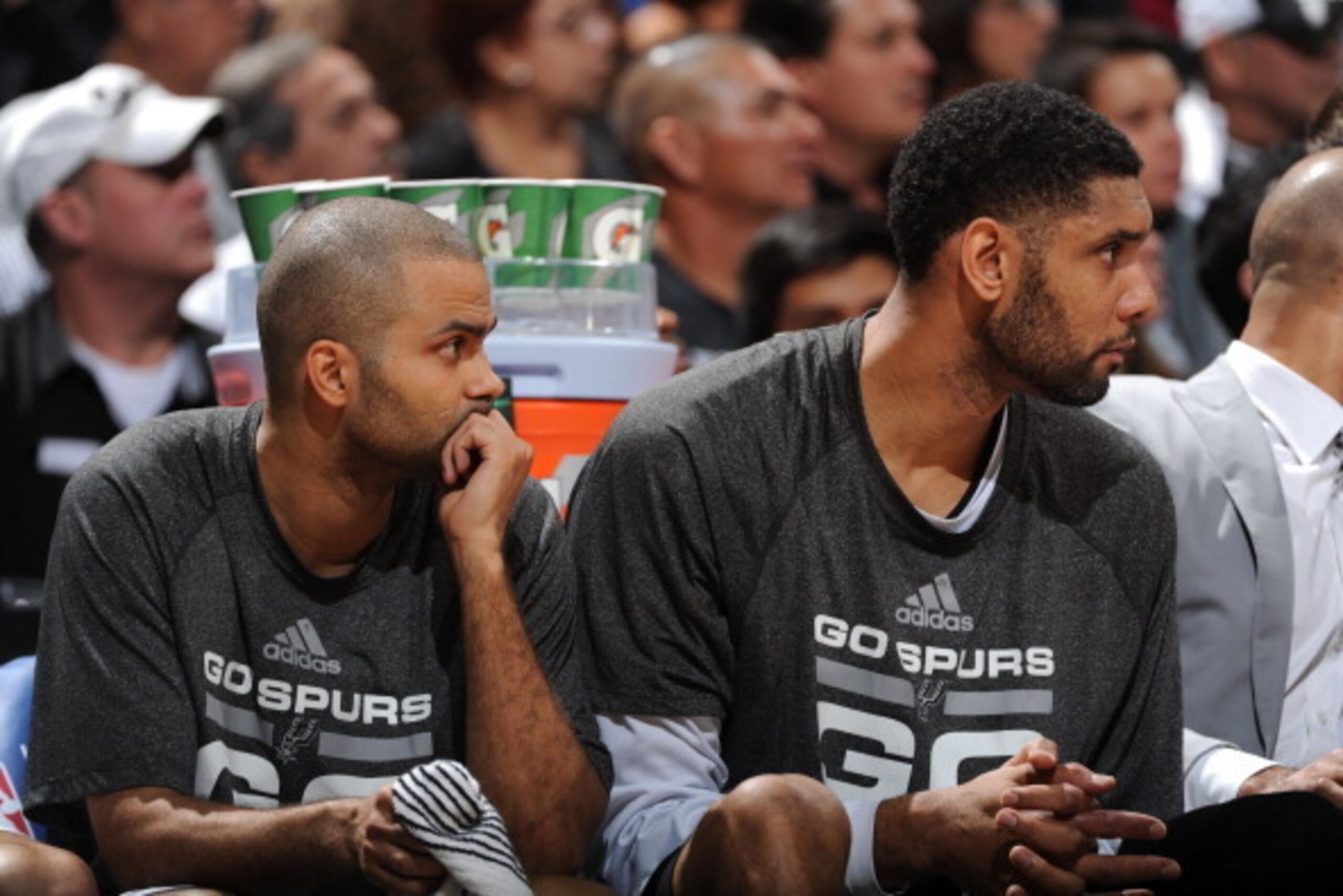 SAN ANTONIO, TX - MAY 14: Tony Parker #9 and Tim Duncan #21 of the San Antonio Spurs look on from the bench in Game Five of the Western Conference Semifinals against the Portland Trail Blazers during the 2014 NBA Playoffs on May 14, 2014 at the AT&T Cente