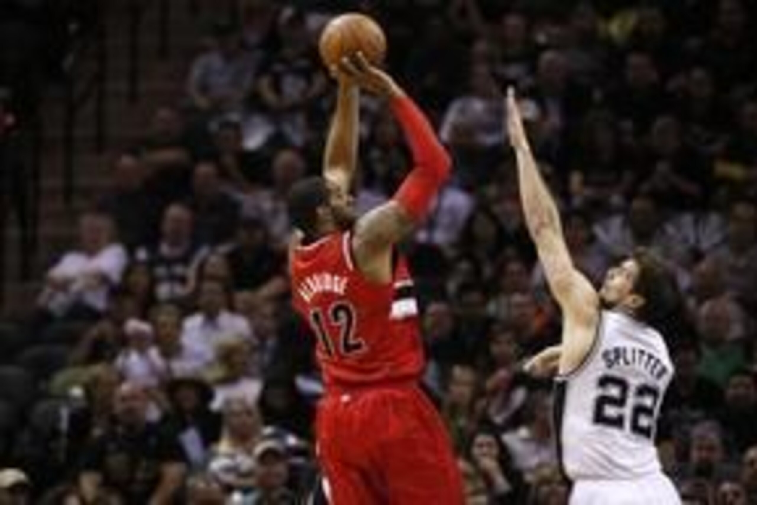 May 14, 2014; San Antonio, TX, USA; Portland Trail Blazers forward LaMarcus Aldridge (12) shoots the ball over San Antonio Spurs forward Tiago Splitter (22) in game five of the second round of the 2014 NBA Playoffs at AT&T Center. Mandatory Credit: Soobum