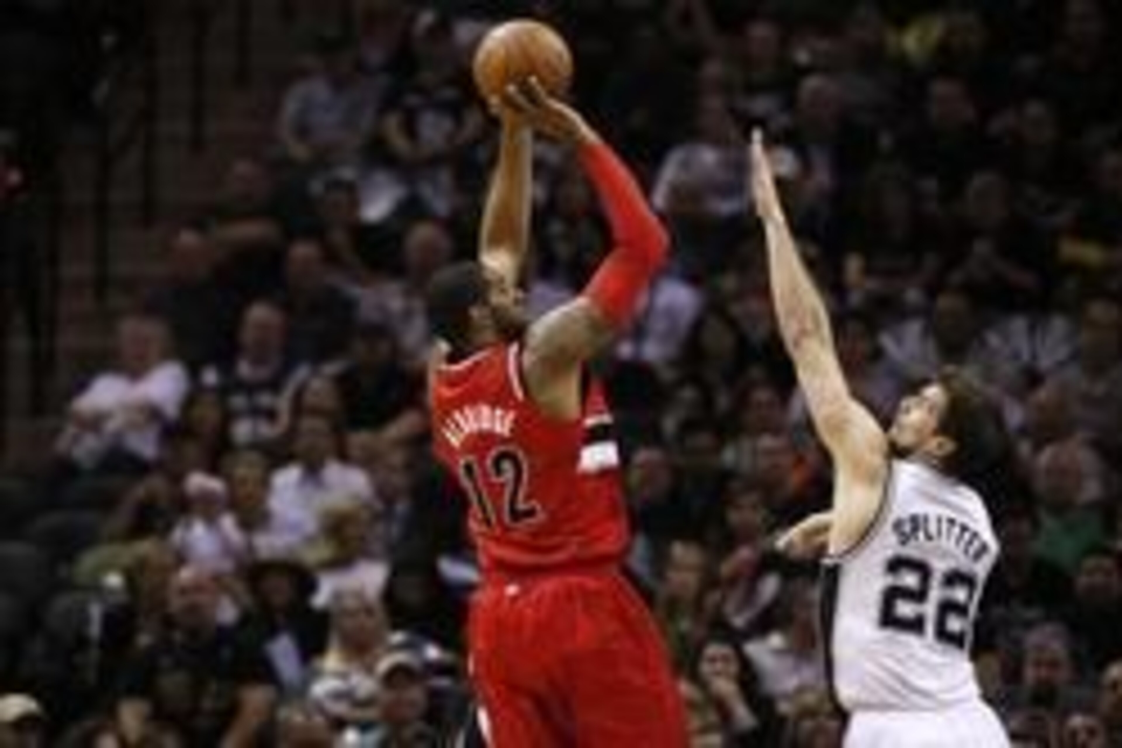May 14, 2014; San Antonio, TX, USA; Portland Trail Blazers forward LaMarcus Aldridge (12) shoots the ball over San Antonio Spurs forward Tiago Splitter (22) in game five of the second round of the 2014 NBA Playoffs at AT&T Center. Mandatory Credit: Soobum