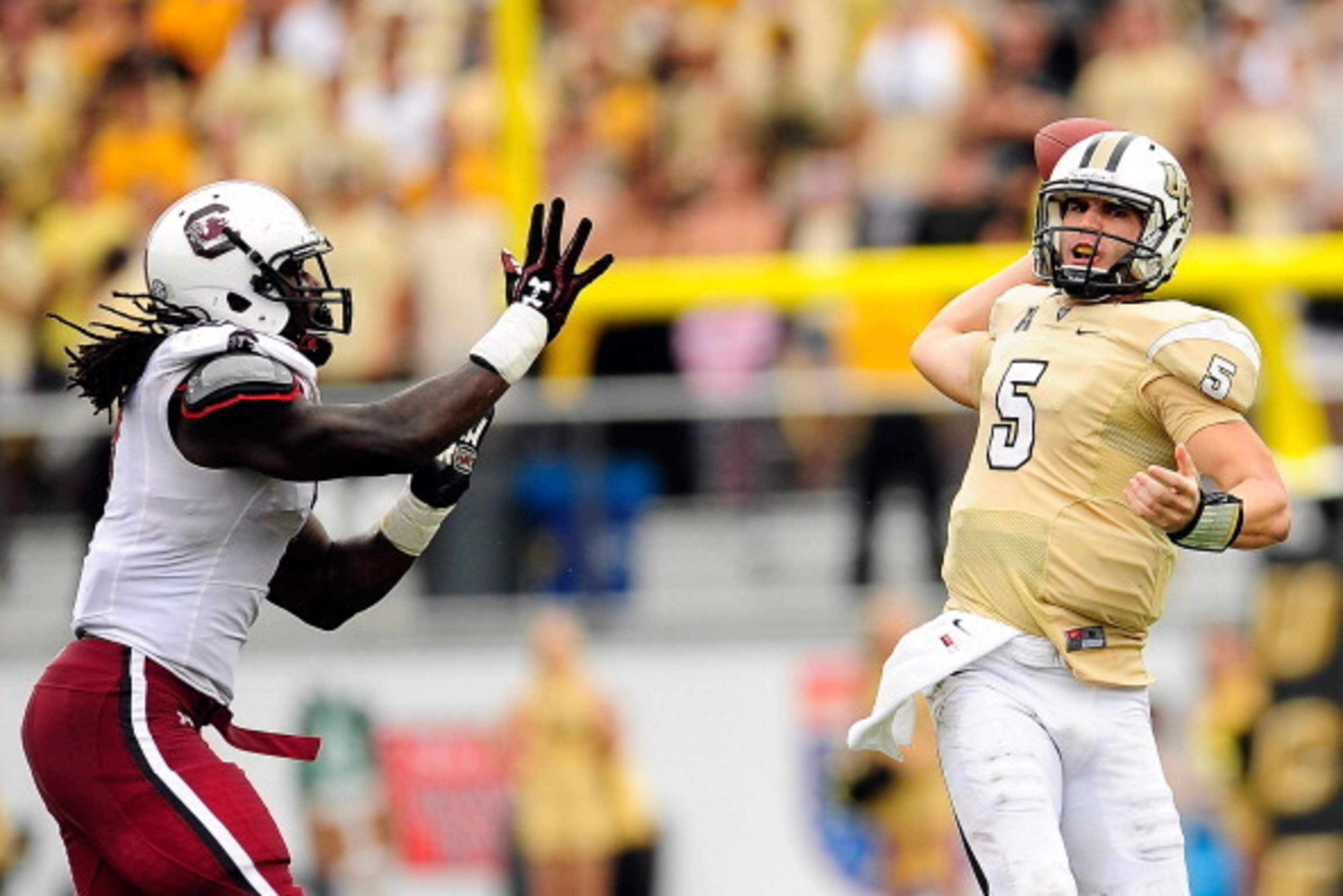 ORLANDO, FL - SEPTEMBER 28:  Jadeveon Clowney #7 of the South Carolina Gamecocks pressures Blake Bortles #5 of the Central Florida Knights during a game at Bright House Networks Stadium on September 28, 2013 in Orlando, Florida.  South Carolina won the ga