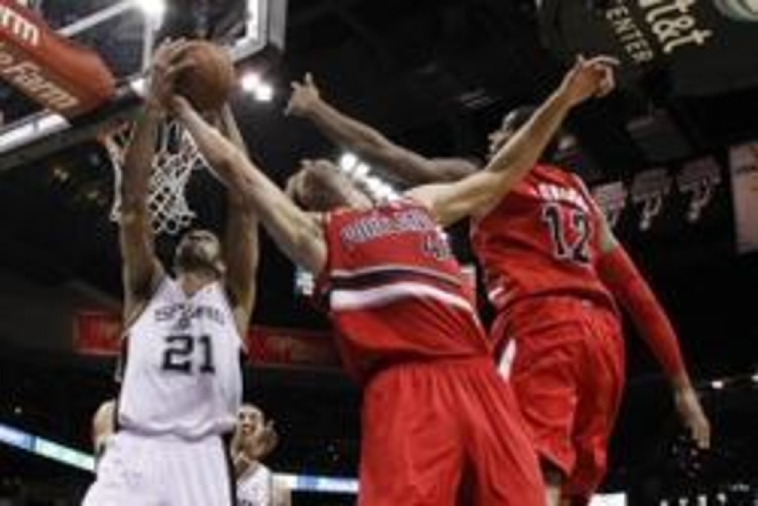 May 14, 2014; San Antonio, TX, USA; San Antonio Spurs forward Tim Duncan (21) and Portland Trail Blazers center Robin Lopez (42) battle for a rebound in game five of the second round of the 2014 NBA Playoffs at AT&T Center. Mandatory Credit: Soobum Im-USA