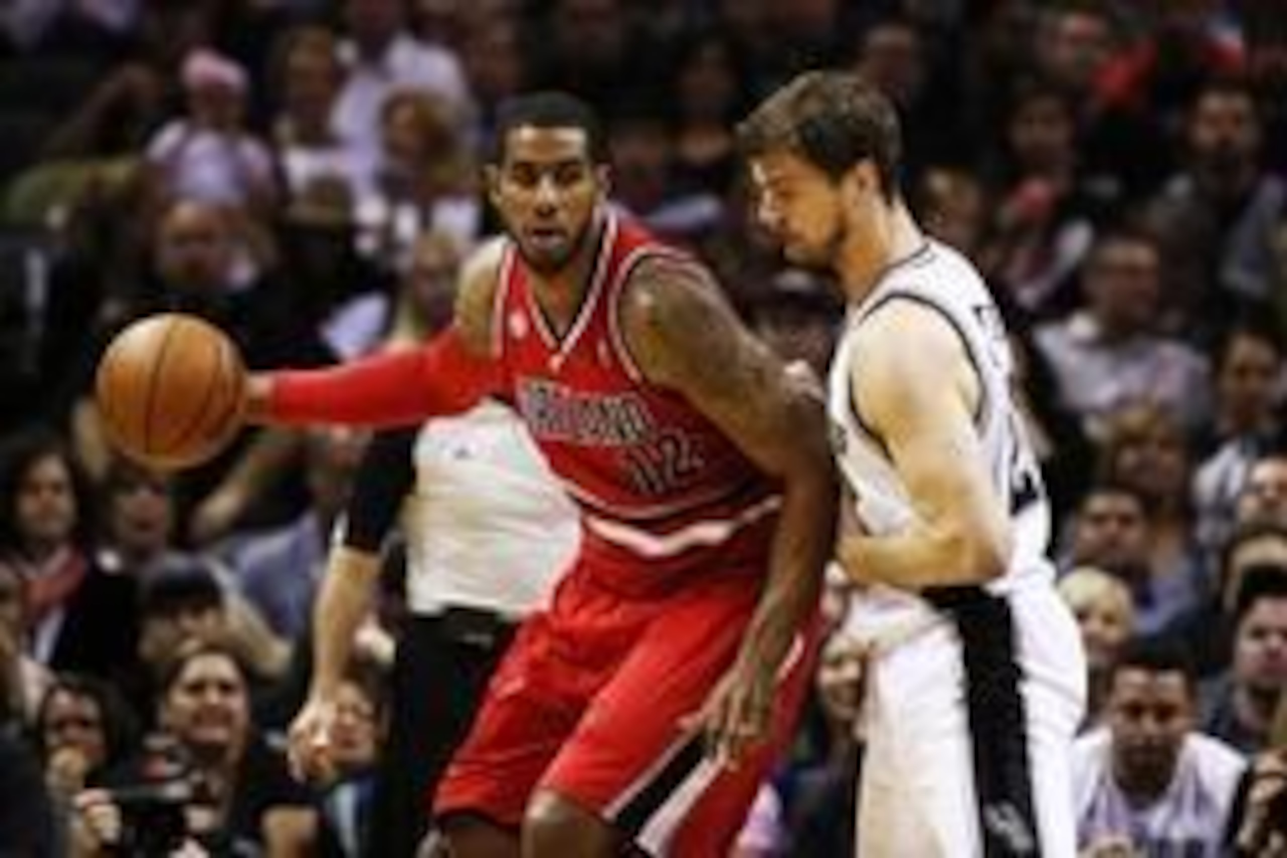 May 14, 2014; San Antonio, TX, USA; Portland Trail Blazers forward LaMarcus Aldridge (12) posts up against San Antonio Spurs forward Tiago Splitter (right) in game five of the second round of the 2014 NBA Playoffs at AT&T Center. Mandatory Credit: Soobum 