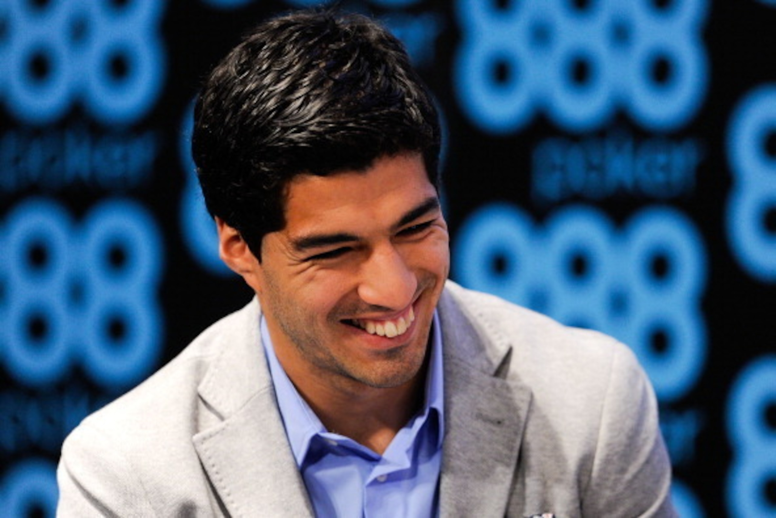 BARCELONA, SPAIN - MAY 14:  Luis Suarez of Liverpool faces the media during the presentation as new Ambassador for 888poker on May 14, 2014 in Barcelona, Spain.  (Photo by David Ramos/Getty Images)