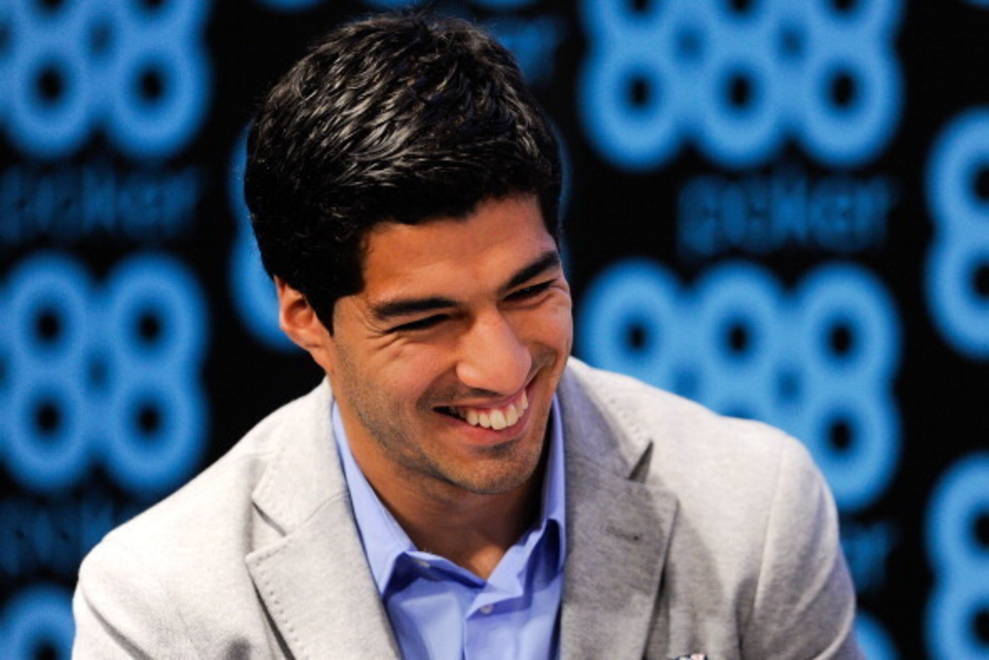 BARCELONA, SPAIN - MAY 14:  Luis Suarez of Liverpool faces the media during the presentation as new Ambassador for 888poker on May 14, 2014 in Barcelona, Spain.  (Photo by David Ramos/Getty Images)