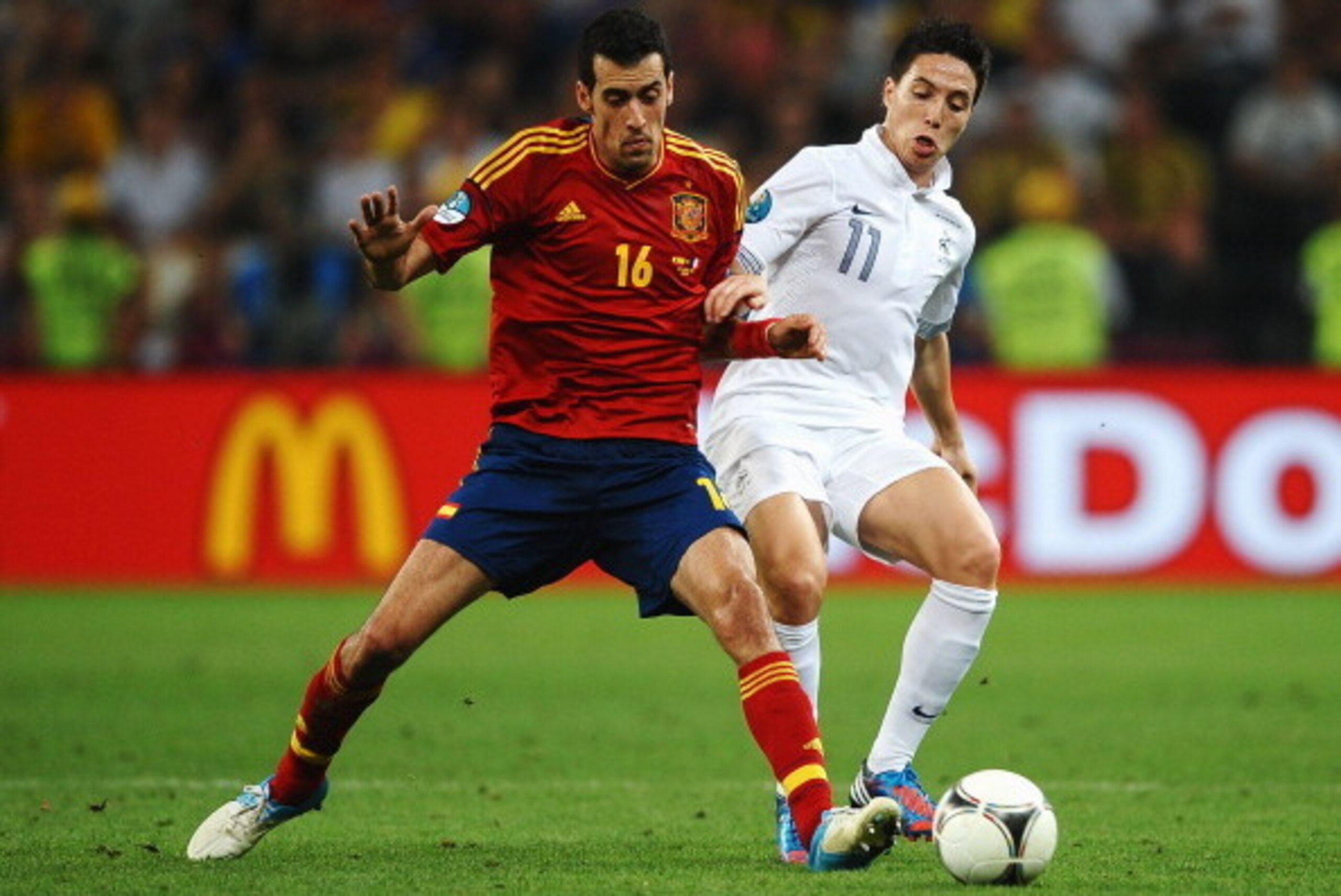 DONETSK, UKRAINE - JUNE 23: Sergio Busquets of Spain and Samir Nasri of France challenge for the ball during the UEFA EURO 2012 quarter final match between Spain and France at Donbass Arena on June 23, 2012 in Donetsk, Ukraine. (Photo by Laurence Griffi DONETSK, UKRAINE - JUNE 23: Sergio Busquets of Spain and Samir Nasri of France challenge for the ball during the UEFA EURO 2012 quarter final match between Spain and France at Donbass Arena on June 23, 2012 in Donetsk, Ukraine. (Photo by Laurence Griffi