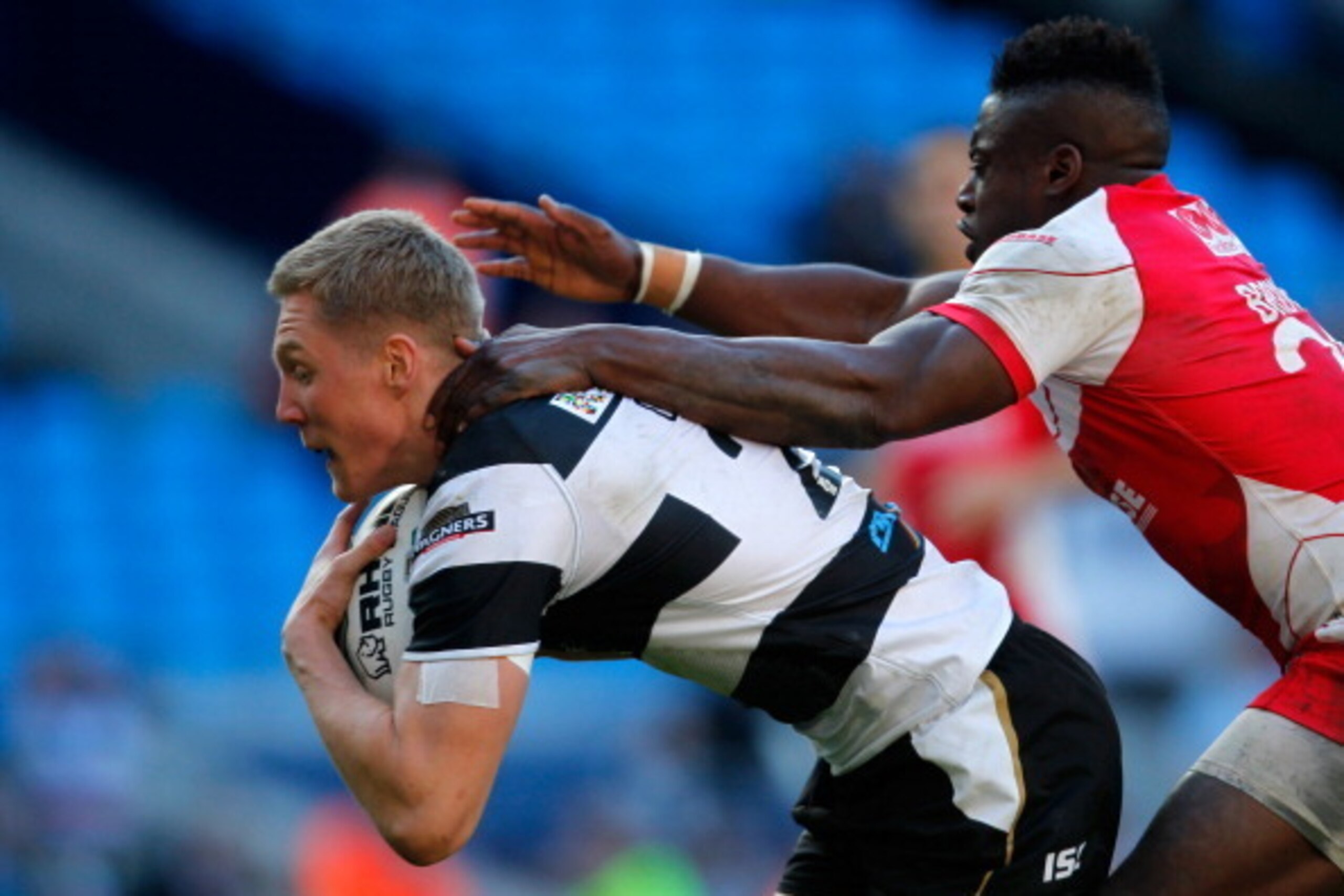 MANCHESTER, ENGLAND - MAY 25:  Chris Green (L) of Hull FC dives over to score the winning try in the tackle of Hull KR's Alex Brown during the Super League Magic Weekend match between Hull FC and Hull Kingston Rovers at the Etihad Stadium on May 25, 2013 
