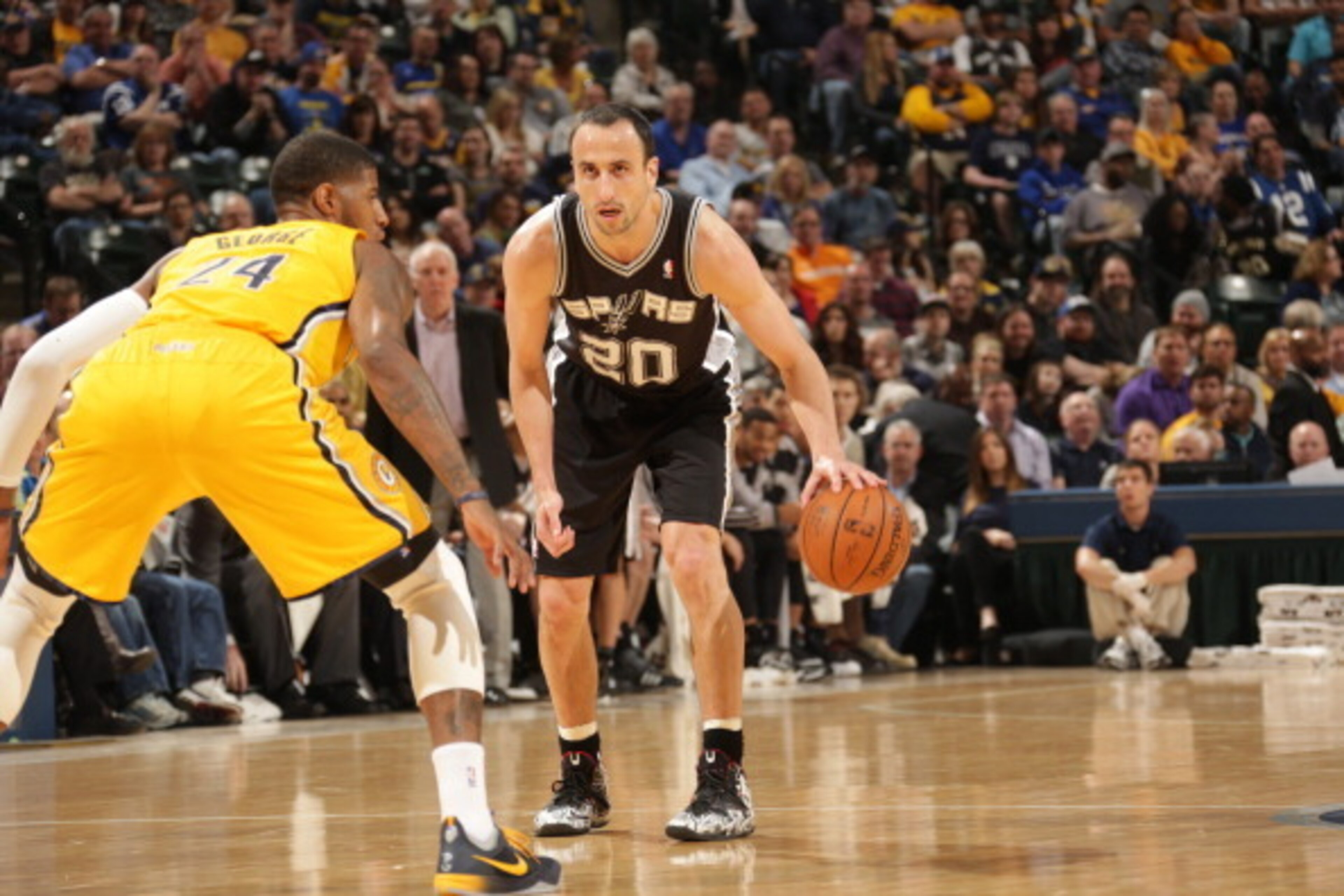 INDIANAPOLIS - MARCH 31: Manu Ginobili #20 of the San Antonio Spurs controls the ball against the Indiana Pacers at Bankers Life Fieldhouse on March 31, 2014 in Indianapolis, Indiana.  NOTE TO USER: User expressly acknowledges and agrees that, by download