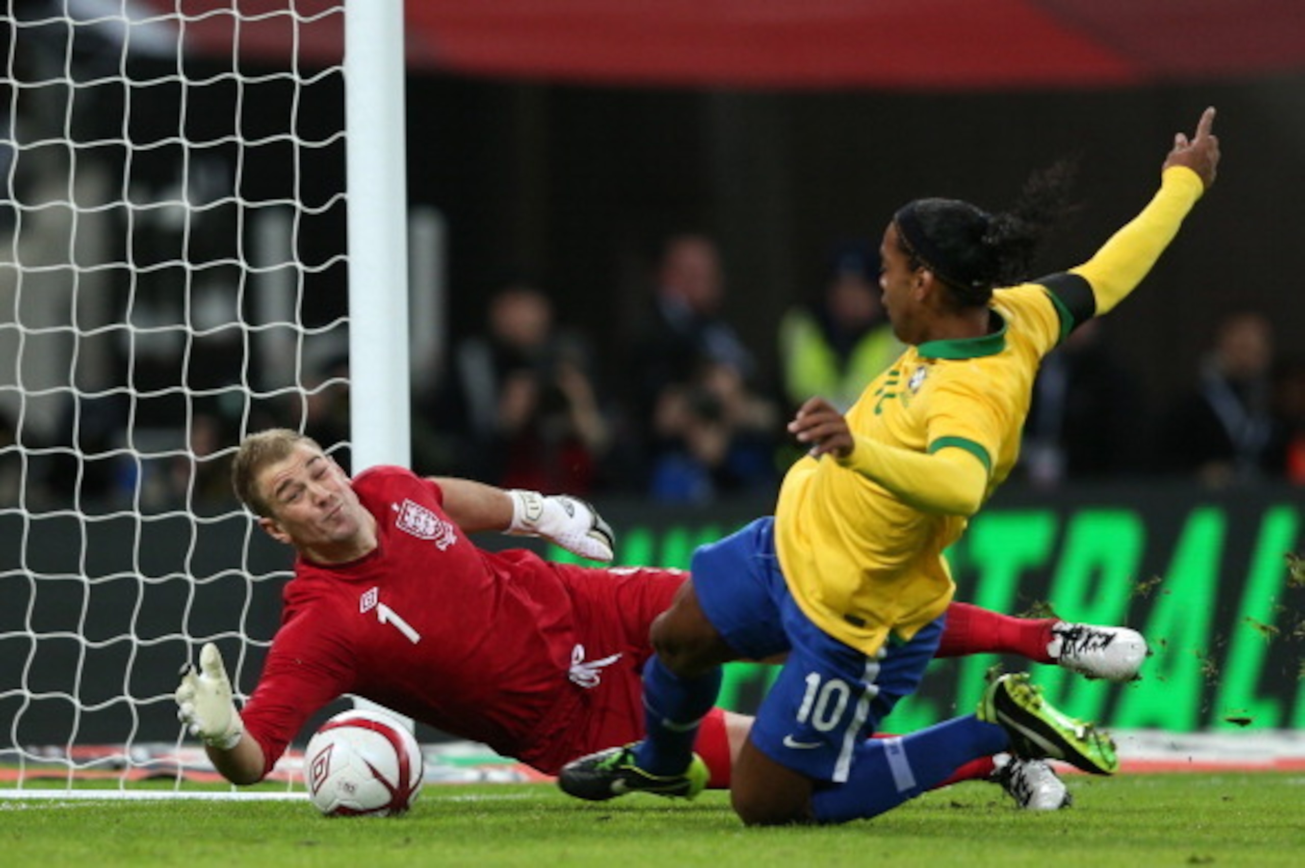 LONDON, ENGLAND - FEBRUARY 06: Joe Hart of England saves a penalty from Ronaldinho of Brazil  during the International friendly between England and Brazil at Wembley Stadium on February 6, 2013 in London, England.  (Photo by Clive Brunskill/Getty Images)