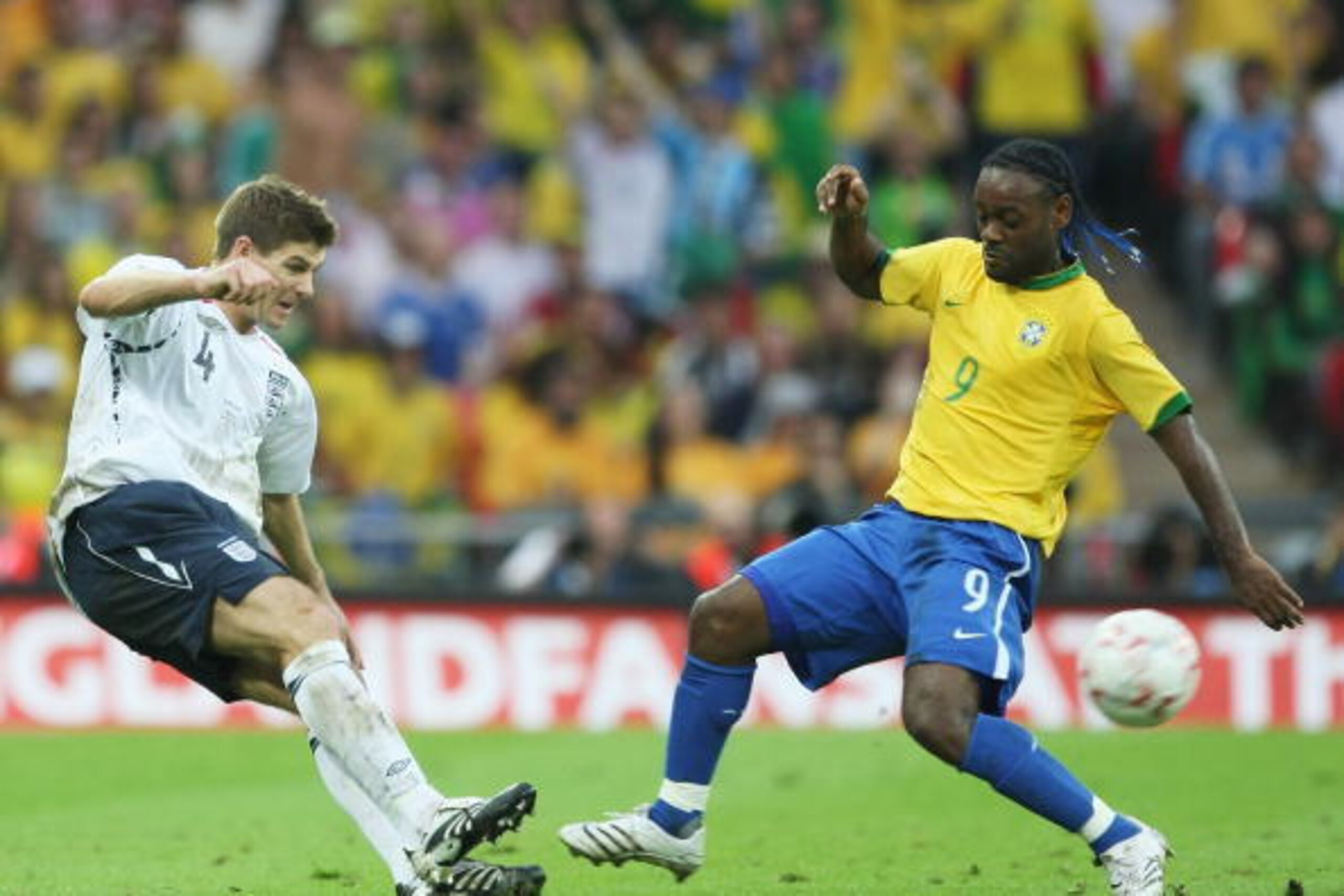 LONDON - JUNE 01:  Steven Gerrard of England (L) tackles Vagner Love of Brazil during the International Friendly match between England and Brazil at Wembley Stadium on June 1, 2007 in London, England.  (Photo by Clive Mason/Getty Images)