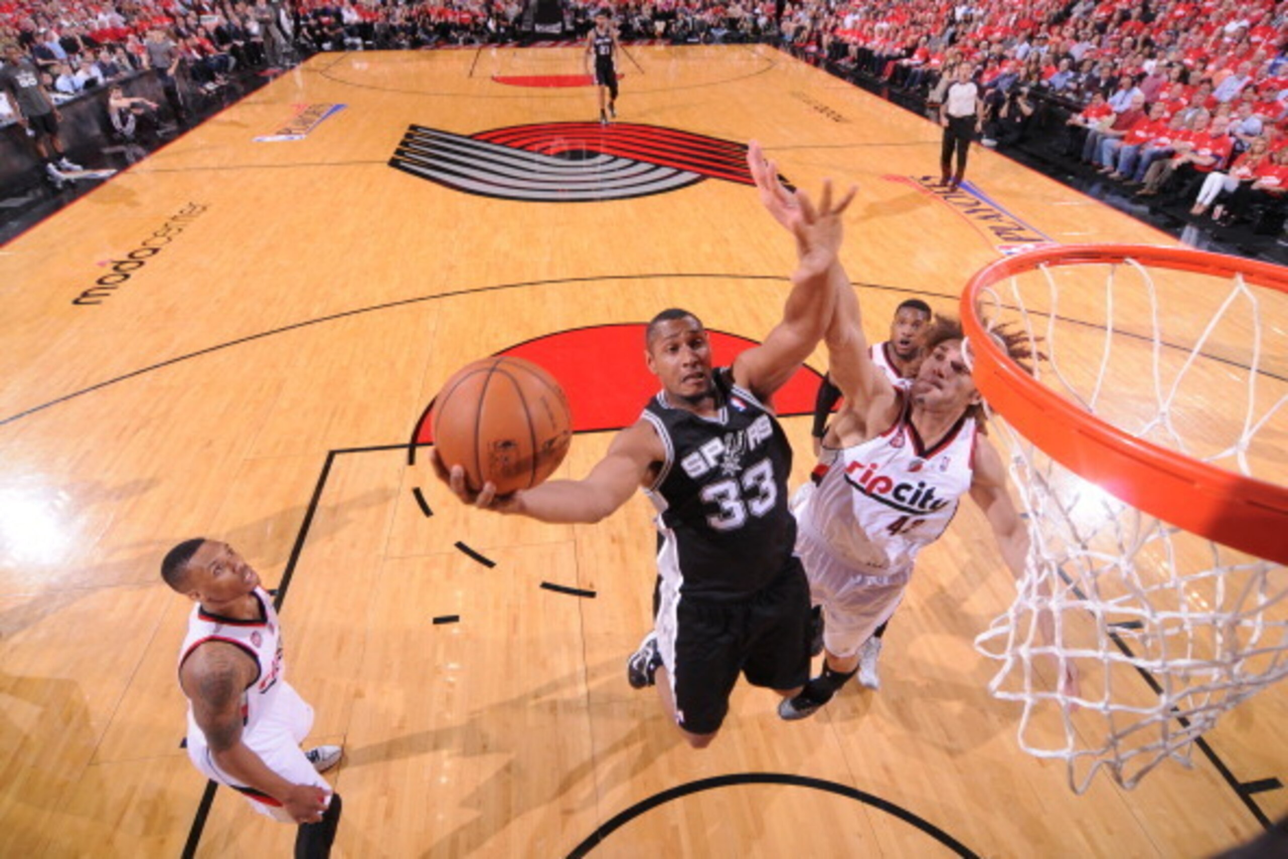 PORTLAND, OR - MAY 12: Boris Diaw #33 of the San Antonio Spurs takes a shot against Portland Trail Blazers in Game Four of the Western Conference Semifinals during the 2014 NBA Playoffs on May 12, 2014 at the Moda Center in Portland, Oregon. NOTE TO USER: