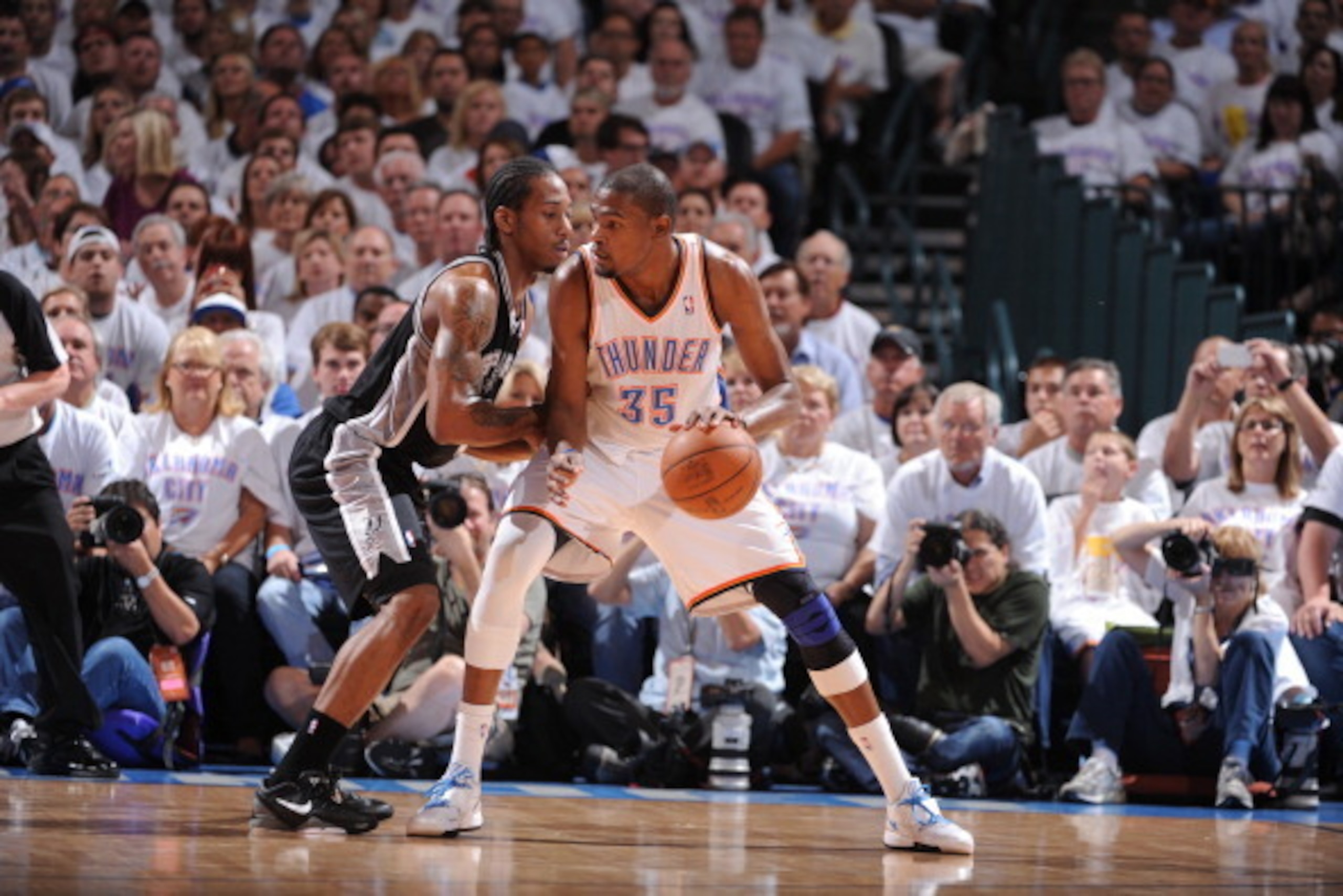 OKLAHOMA CITY, OK - JUNE 06:  Kevin Durant #35 of the Oklahoma City Thunder controls the ball against Kawhi Leonard #2 of the San Antonio Spurs in Game Six of the Western Conference Finals during the 2012 NBA Playoffs on June 6, 2012 at the Chesapeake Ene