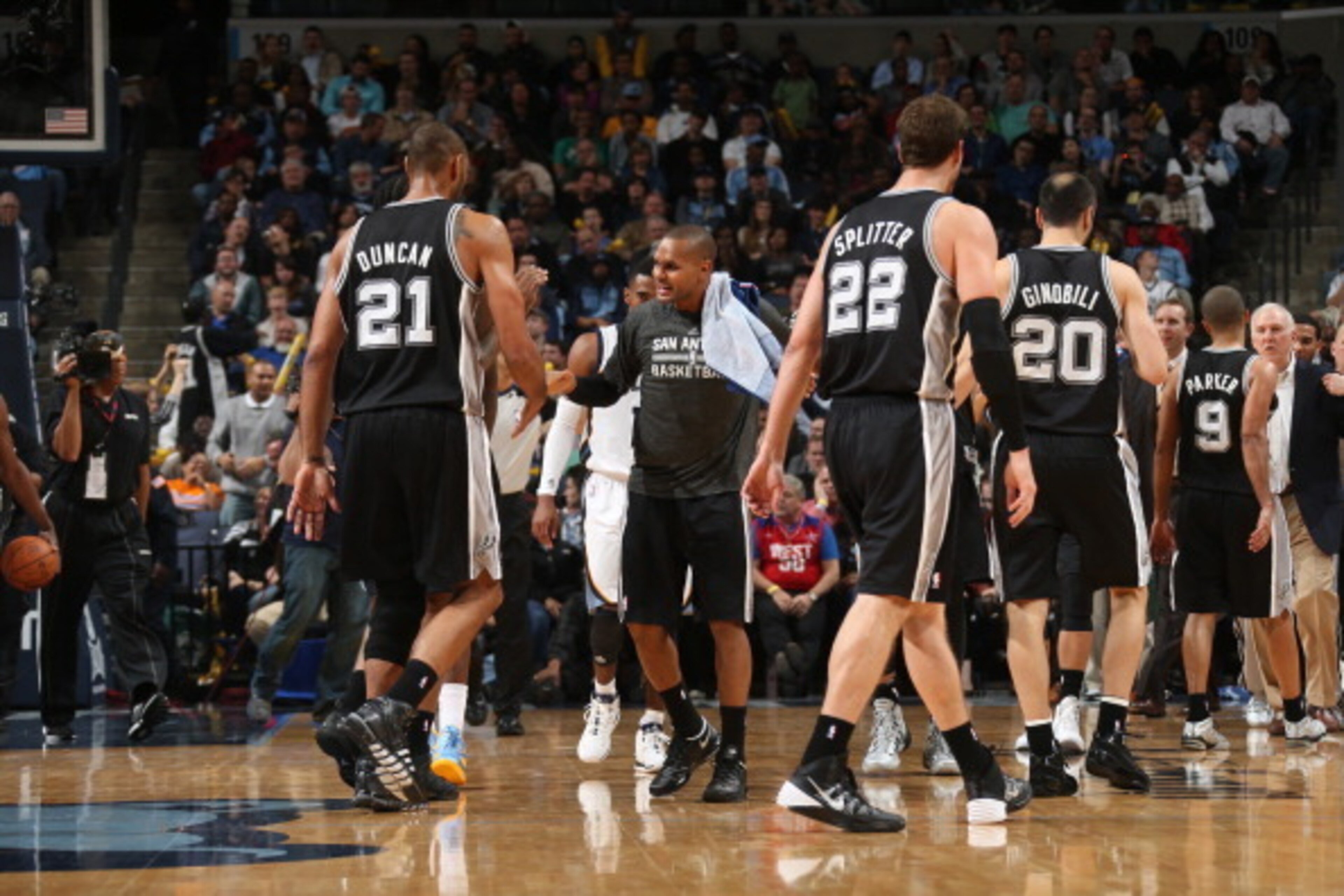 MEMPHIS, TN - NOVEMBER 22: Patty Mills #8 and Tim Duncan #21 of the San Antonio Spurs celebrate during a game against the Memphis Grizzlies on November 22, 2013 at FedExForum in Memphis, Tennessee. NOTE TO USER: User expressly acknowledges and agrees that