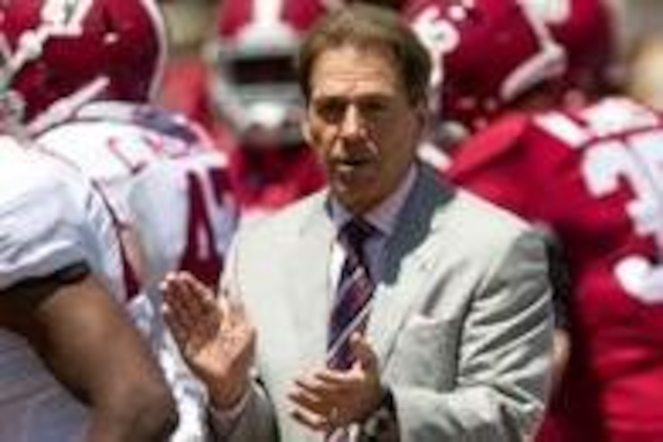 Apr 19, 2014; Tuscaloosa, AL, USA;  Alabama Crimson Tide head coach Nick Saban brings the team on to the field prior to the A-Day game at Bryant-Denny Stadium. Mandatory Credit: Marvin Gentry-USA TODAY Sports
