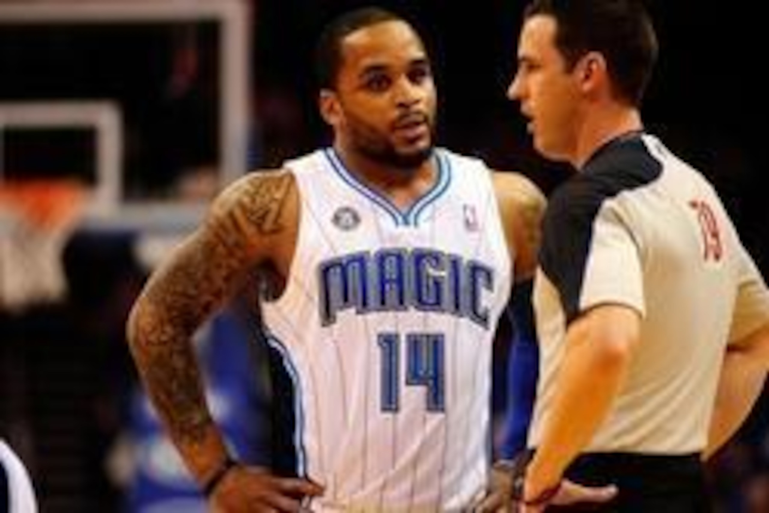 Mar 30, 2014; Orlando, FL, USA; Orlando Magic guard Jameer Nelson (14) talks with referee Kevin Scott (79) during a timeout in the first quarter against the Toronto Raptors at Amway Center. Mandatory Credit: David Manning-USA TODAY Sports