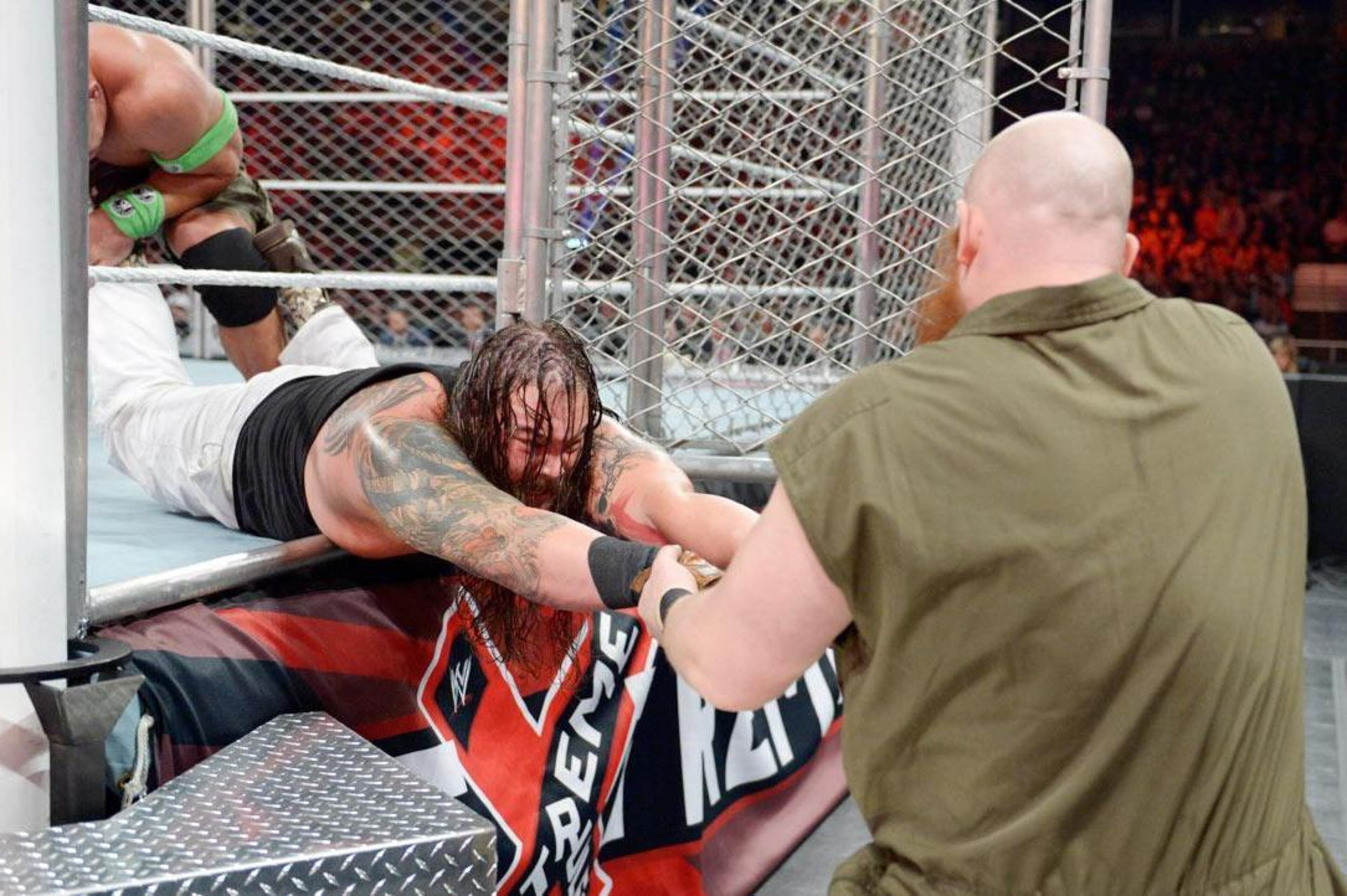 Erick Rowan gives Bray Wyatt an assist.