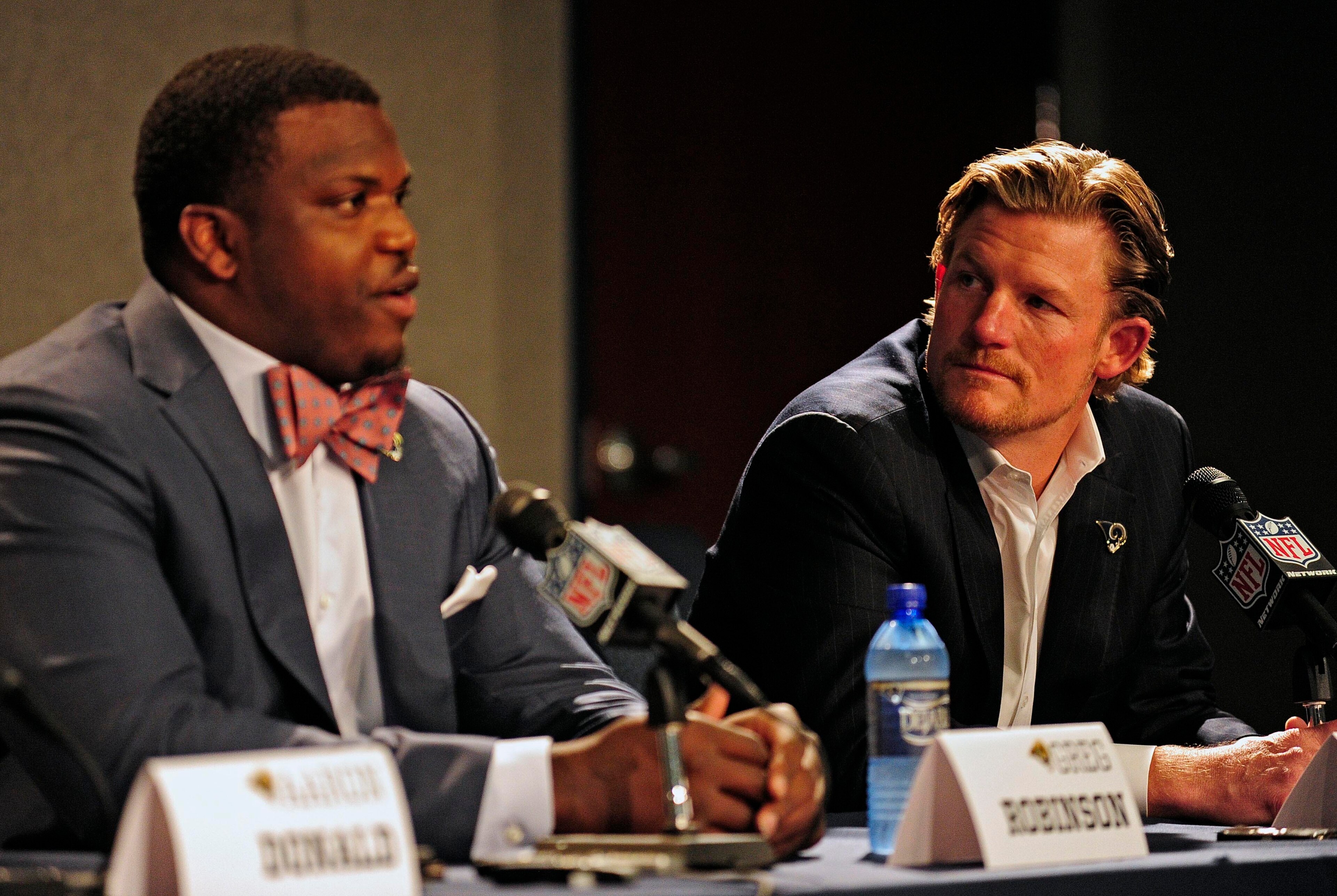 May 13, 2014; St. Louis, MO, USA; St. Louis Rams general manager Les Snead looks on as first-round pick offensive lineman Greg Robinson talks with the media during a press conference at Rams Park. Mandatory Credit: Jeff Curry-USA TODAY Sports