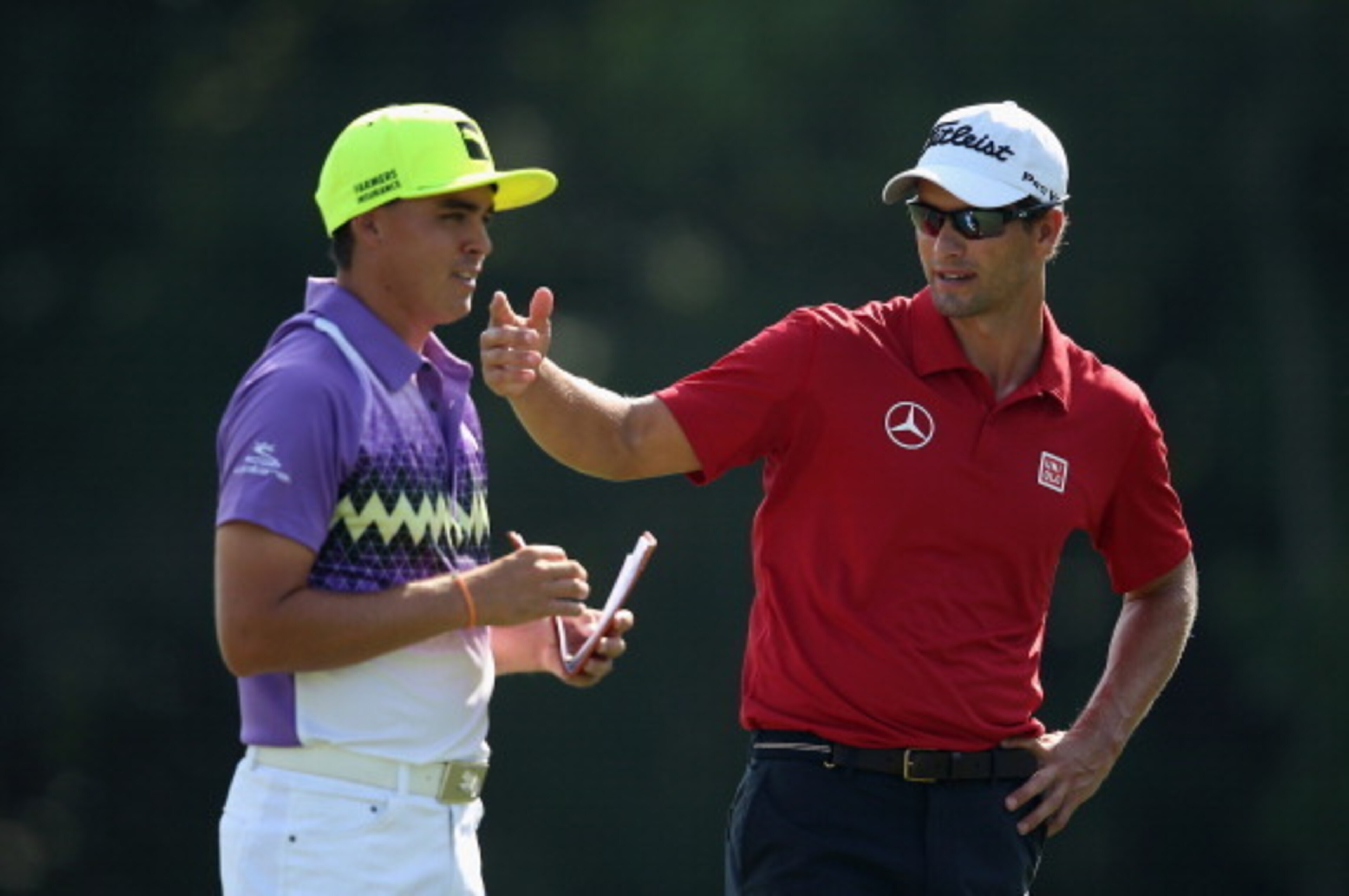 PONTE VEDRA BEACH, FL - MAY 09:  Rickie Fowler of the United States and Adam Scott of Australia chat together on the 14th hole during the second round of THE PLAYERS Championship on The Stadium Course at TPC Sawgrass on May 9, 2014 in Ponte Vedra Beach, F