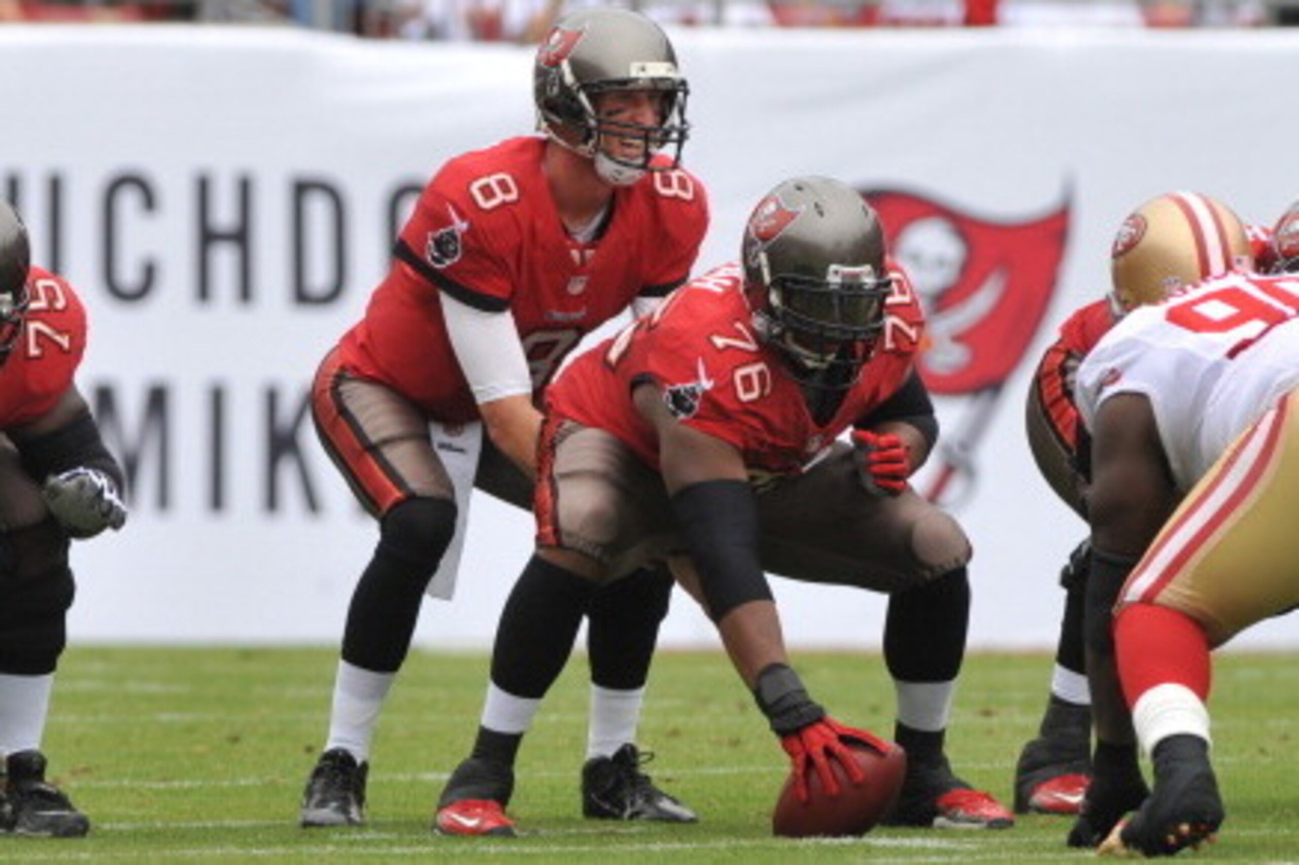TAMPA, FL -  DECEMBER 15:  Quarterback Mike Glennon #8 of the Tampa Bay Buccaneers lines up behind center Jeremy Zuttah #76  against the San Francisco 49ers December 15, 2013 at Raymond James Stadium in Tampa, Florida.  (Photo by Al Messerschmidt/Getty Im