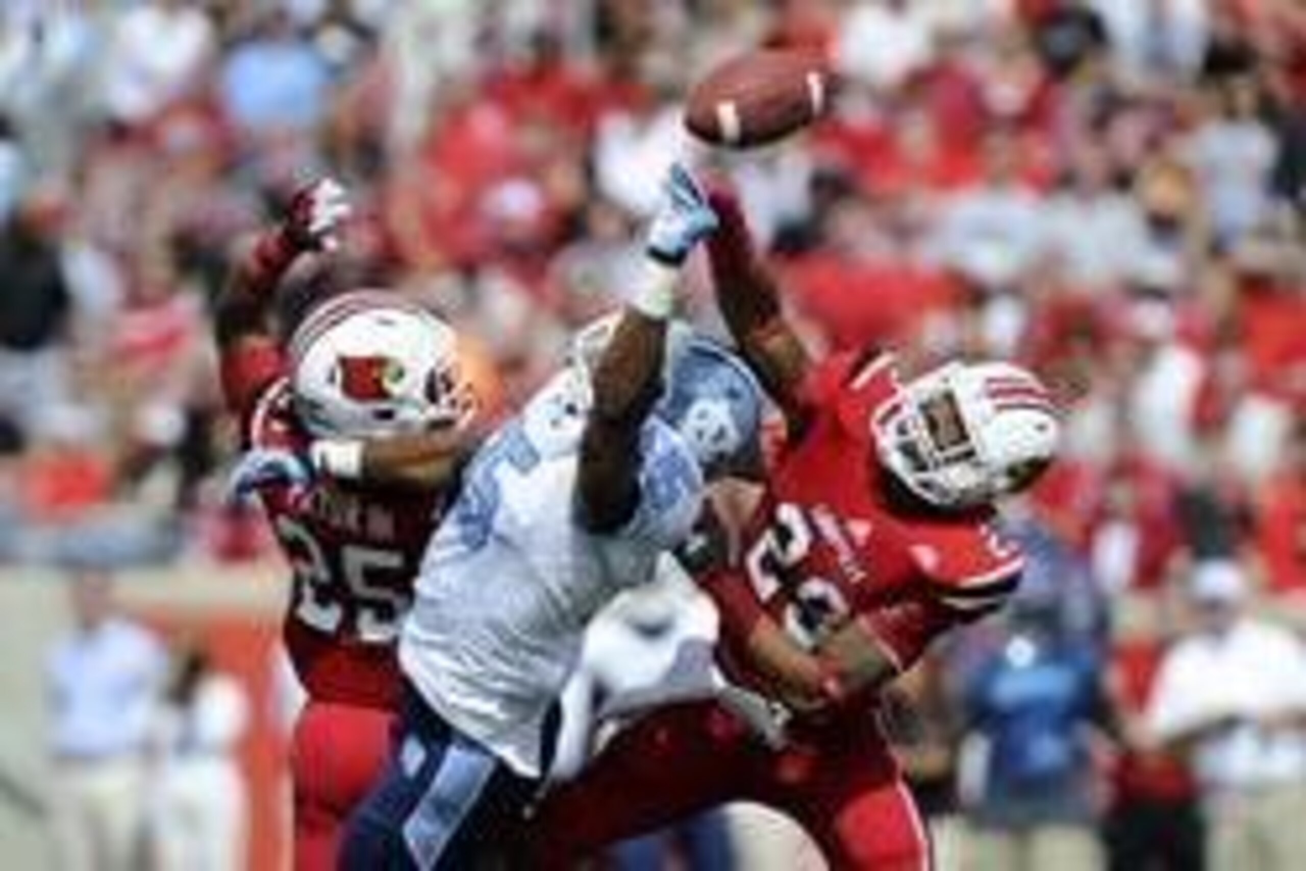 September 15,  2012; Louisville, KY USA;  Louisville Cardinals safety Hakeem Smith (29) and safety Calvin Pryor (25) break up a pass intended for North Carolina Tar Heels tight end Eric Ebron (85) during the first half of play at Papa John's Cardinals Sta