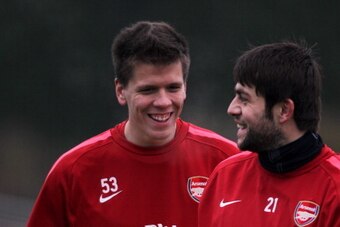ST ALBANS, ENGLAND - DECEMBER 15:  Goalkeepers, Wojciech Szczesny and Lukasz Fabianski have a laugh during the Arsenal Training Session at London Colney on December 15, 2010 in St Albans, England.  (Photo by Dean Mouhtaropoulos/Getty Images)