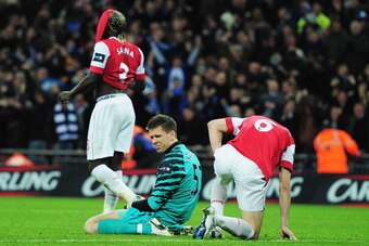LONDON, ENGLAND - FEBRUARY 27:  Goalkeeper Wojciech Szczesny (C) of Arsenal and Laurent Koscielny react after a defensive mistake leading to the Birmingham City winning goal during the Carling Cup Final between Arsenal and Birmingham City at Wembley Stadi