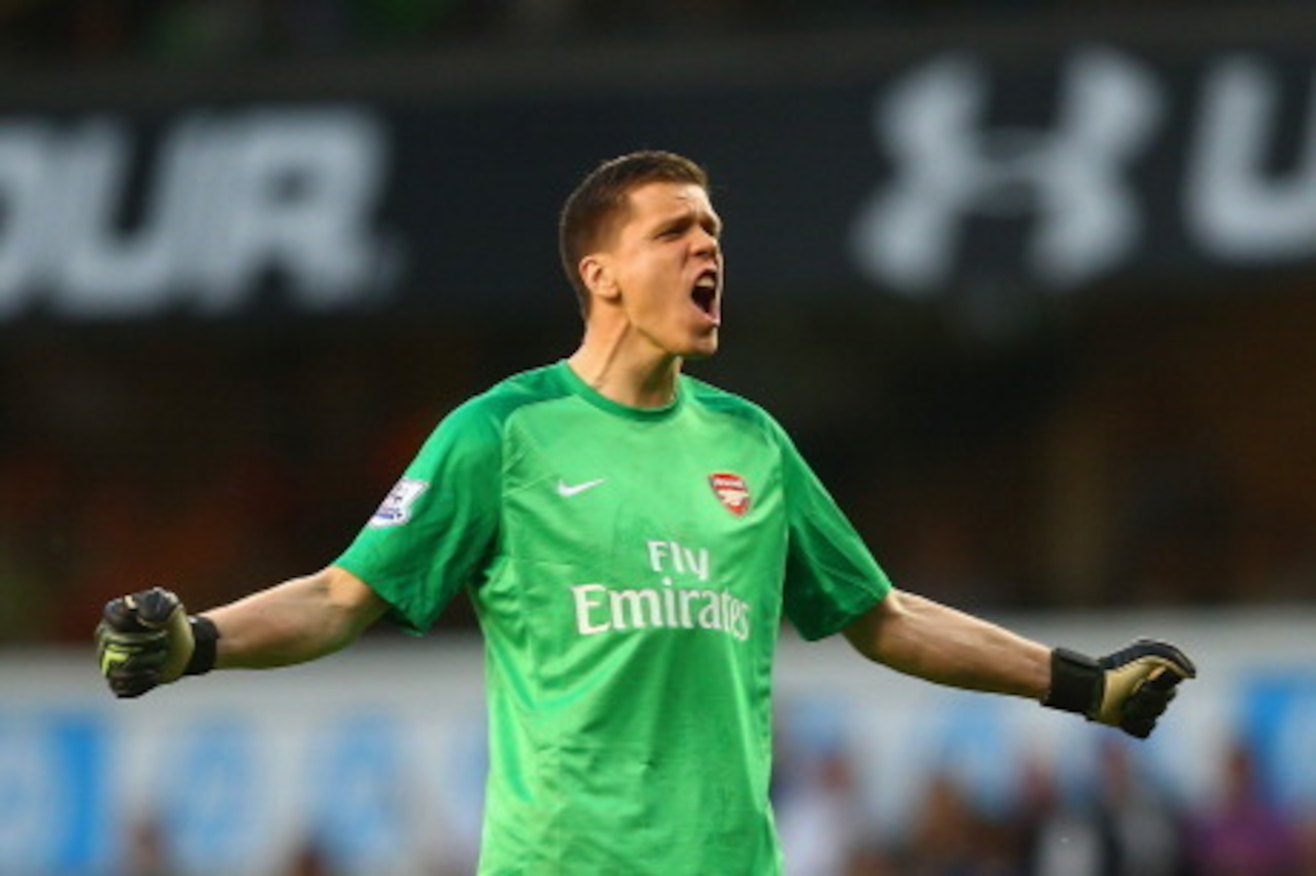 LONDON, ENGLAND - MARCH 16:  Wojciech Szczesny of Arsenal celebrates victory at the final whistle during the Barclays Premier League match between Tottenham Hotspur and Arsenal at White Hart Lane on March 16, 2014 in London, England.  (Photo by Paul Gilha