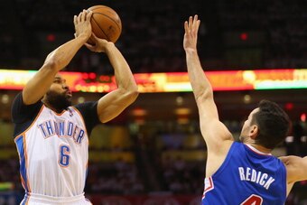 OKLAHOMA CITY, OK - MAY 13:  Derek Fisher #6 of the Oklahoma City Thunder takes a shot againt J.J. Redick #4 of the Los Angeles Clippers in Game Five of the Western Conference Semifinals during the 2014 NBA Playoffs at Chesapeake Energy Arena on May 13, 2