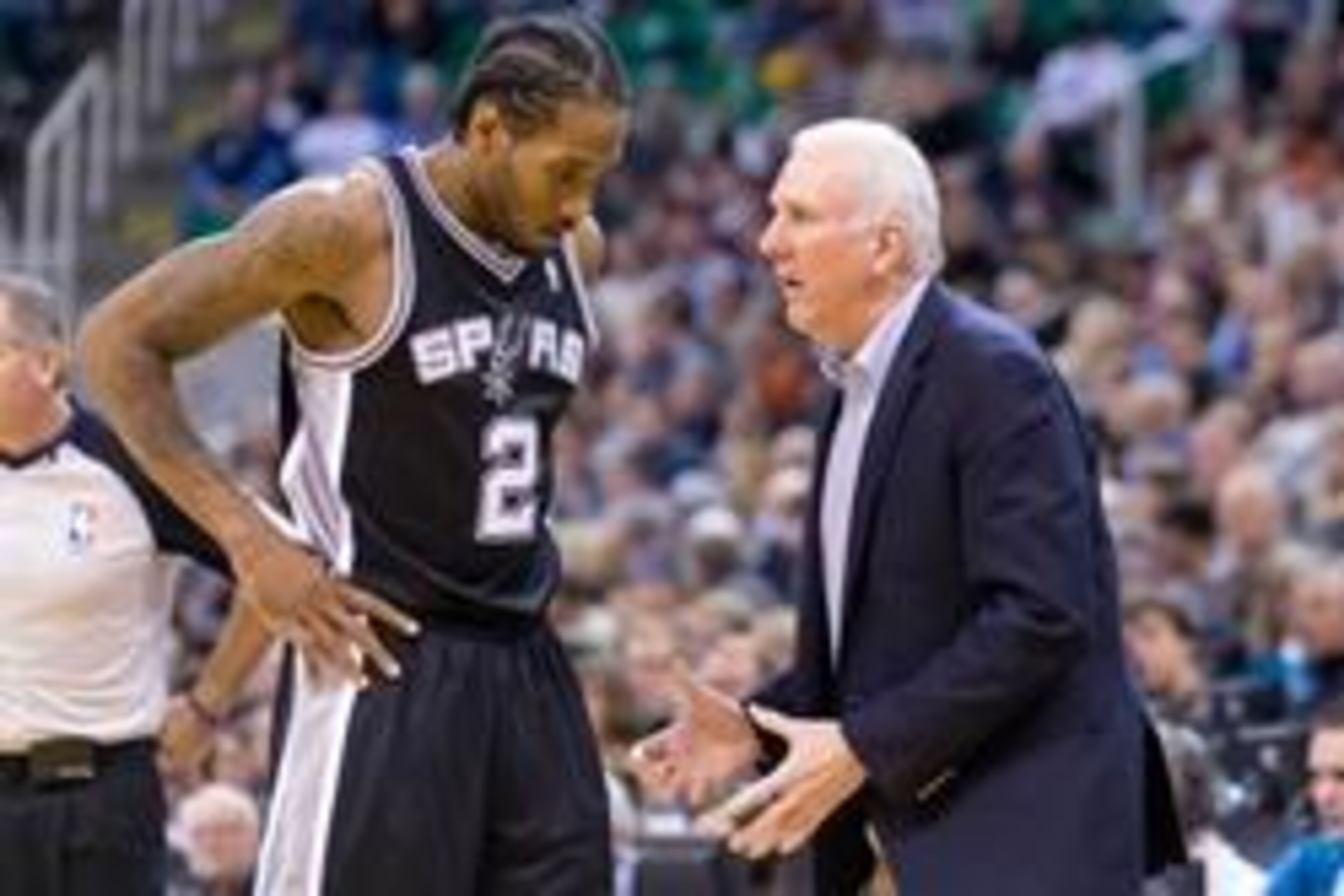 Nov 15, 2013; Salt Lake City, UT, USA; San Antonio Spurs head coach Gregg Popovich talks with small forward Kawhi Leonard (2) during the second half against the Utah Jazz at EnergySolutions Arena. San Antonio won 91-82. Mandatory Credit: Russ Isabella-USA Nov 15, 2013; Salt Lake City, UT, USA; San Antonio Spurs head coach Gregg Popovich talks with small forward Kawhi Leonard (2) during the second half against the Utah Jazz at EnergySolutions Arena. San Antonio won 91-82. Mandatory Credit: Russ Isabella-USA