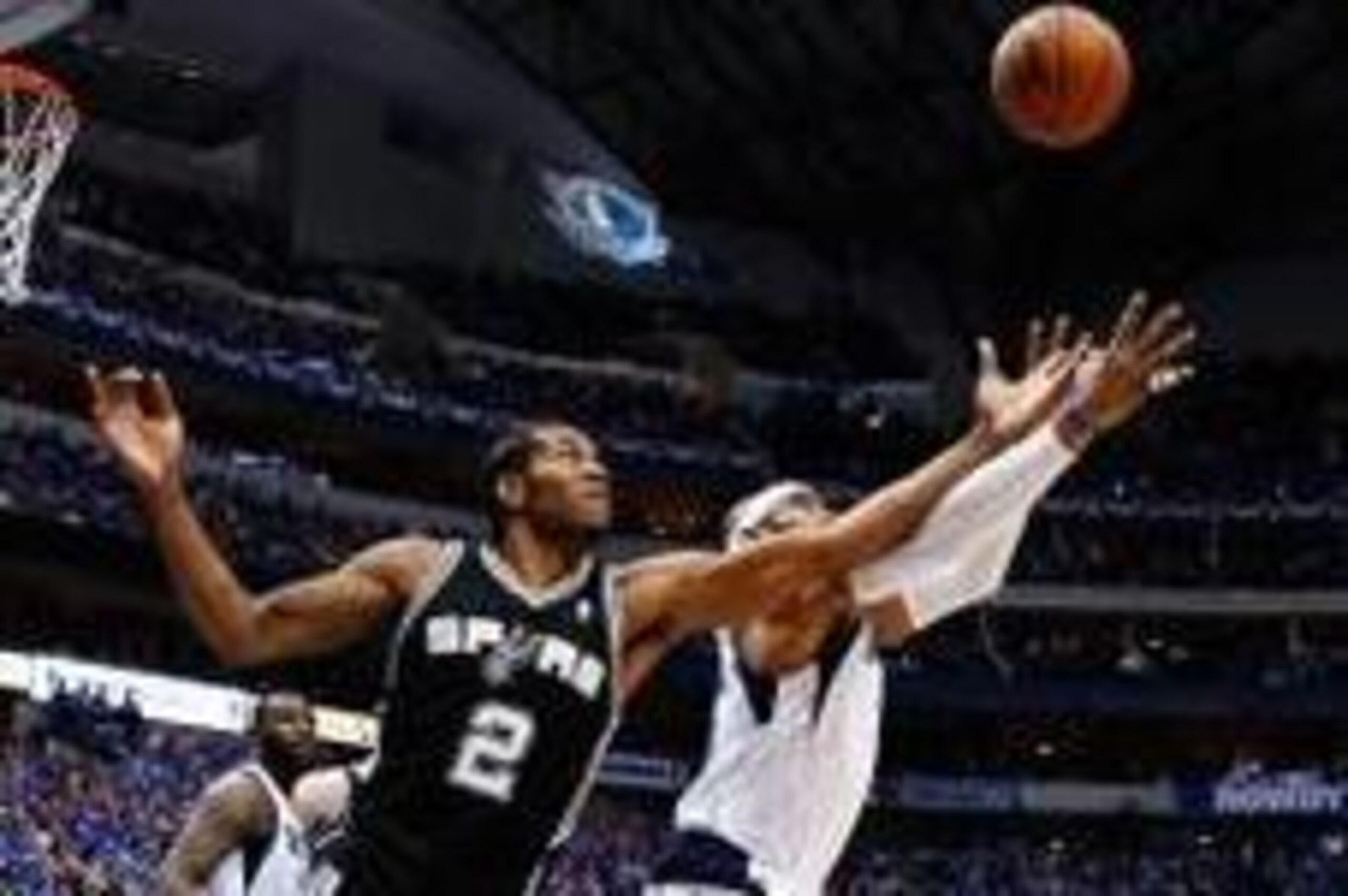 May 2, 2014; Dallas, TX, USA; San Antonio Spurs forward Kawhi Leonard (2) battles with Dallas Mavericks guard Vince Carter (25) for the ball  in game six of the first round of the 2014 NBA Playoffs at American Airlines Center. Mandatory Credit: Kevin Jair