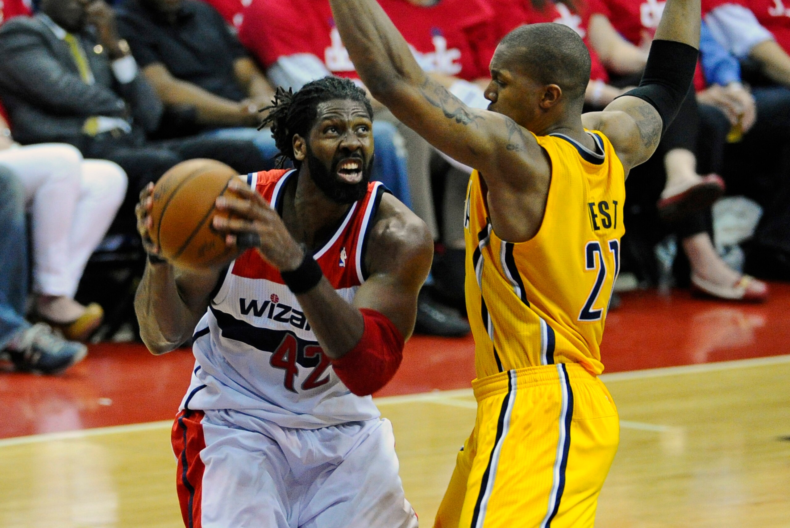 May 15, 2014; Washington, DC, USA; Washington Wizards power forward Nene (42) prepares to shoot as Indiana Pacers power forward David West (21) defends during the first half in game six of the second round of the 2014 NBA Playoffs at Verizon Center. Manda