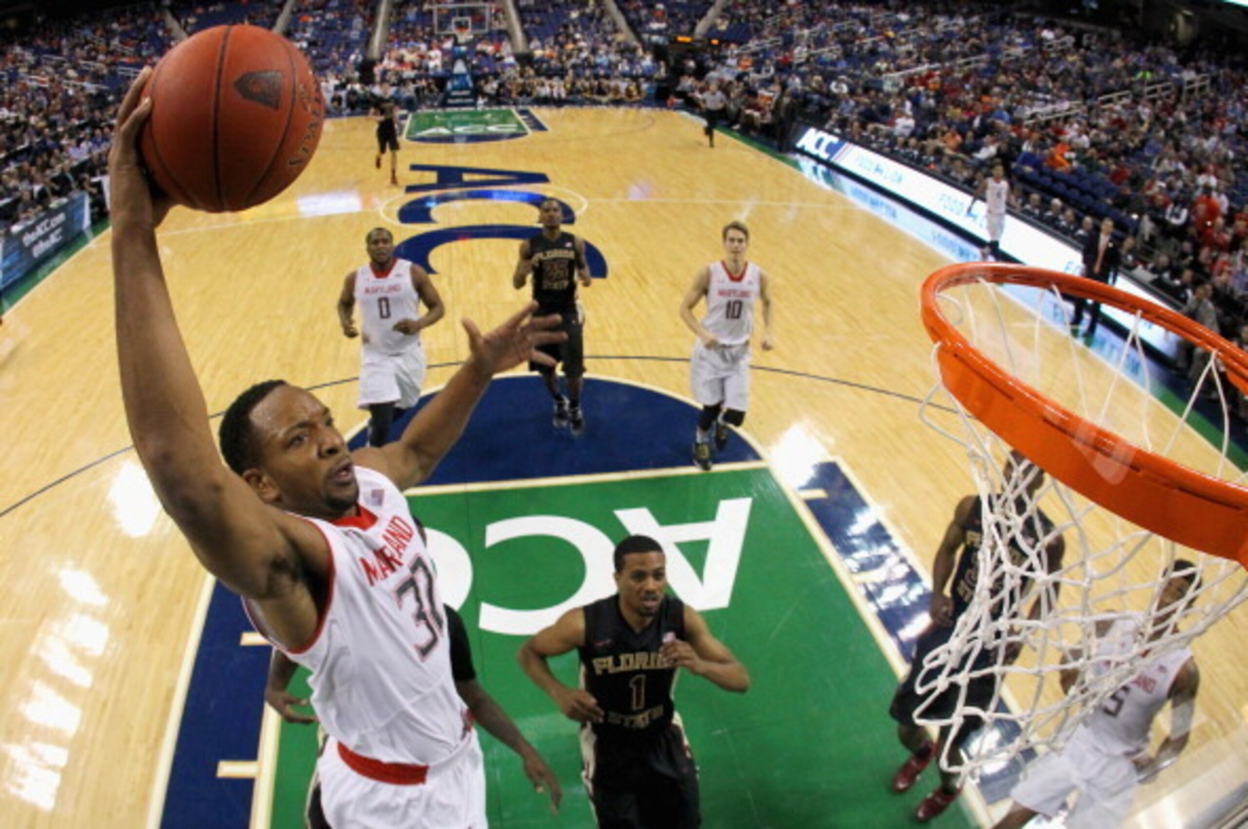 GREENSBORO, NC - MARCH 13: Dez Wells #32 of the Maryland Terrapins dunks the ball against the Florida State Seminoles during the second round of the 2014 Men's ACC Basketball Tournament at Greensboro Coliseum on March 13, 2014 in Greensboro, North Caroli GREENSBORO, NC - MARCH 13: Dez Wells #32 of the Maryland Terrapins dunks the ball against the Florida State Seminoles during the second round of the 2014 Men's ACC Basketball Tournament at Greensboro Coliseum on March 13, 2014 in Greensboro, North Caroli