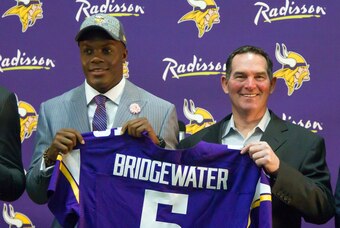 May 9, 2014; Eden Prairie, MN, USA; Minnesota Vikings quarterback Teddy Bridgewater (left) and head coach Mike Zimmer pose for pictures at Winter Park Fieldhouse. Mandatory Credit: Brad Rempel-USA TODAY Sports